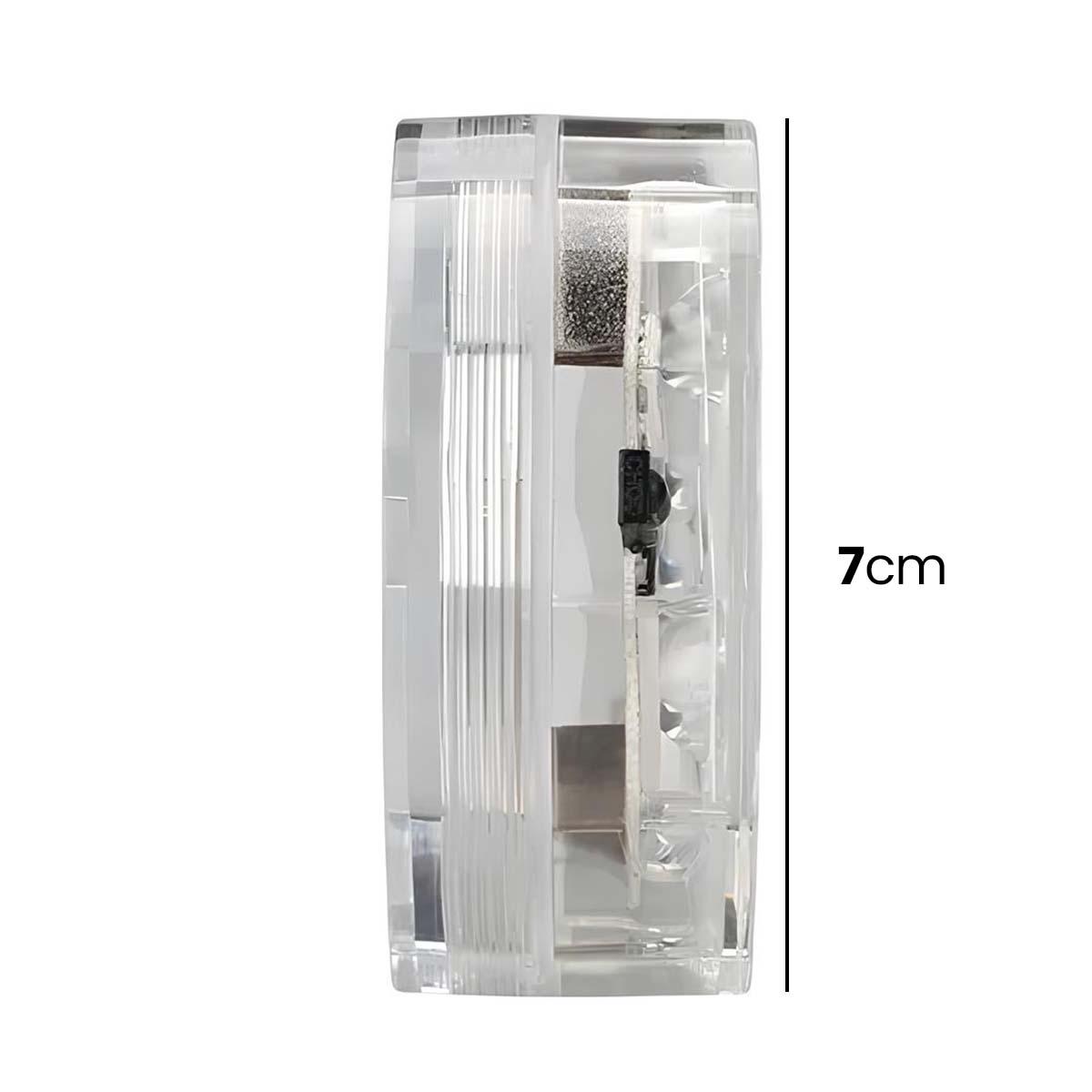 Cilindro transparente con componentes internos y marca de altura de 7 cm.