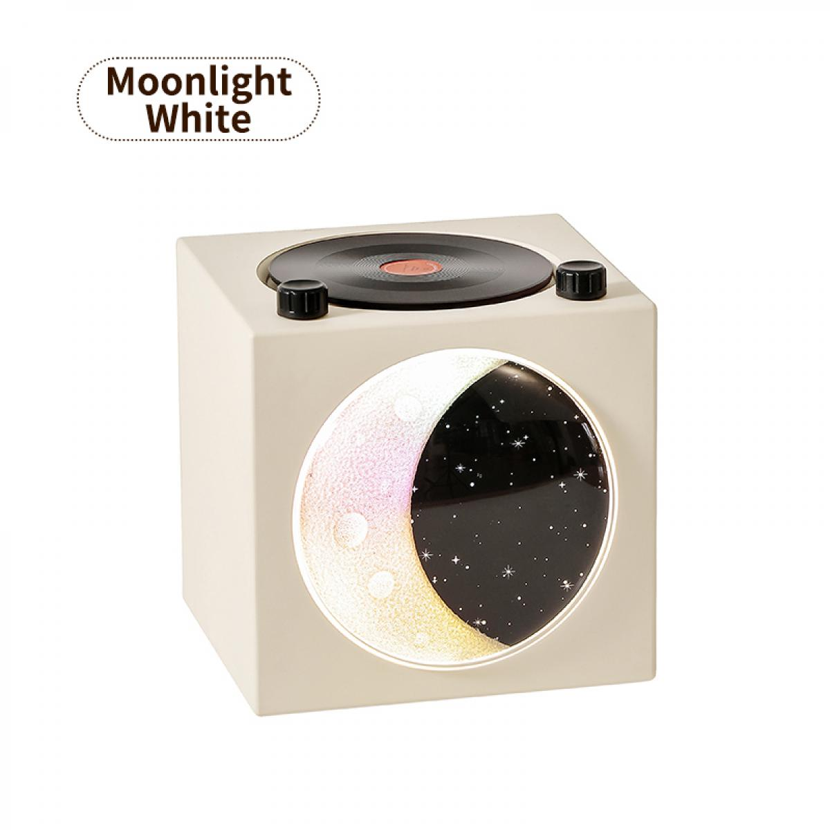Ein cremefarbener Würfel mit einer Schallplatte oben und einem Mond-Sternen-Bild vorne.