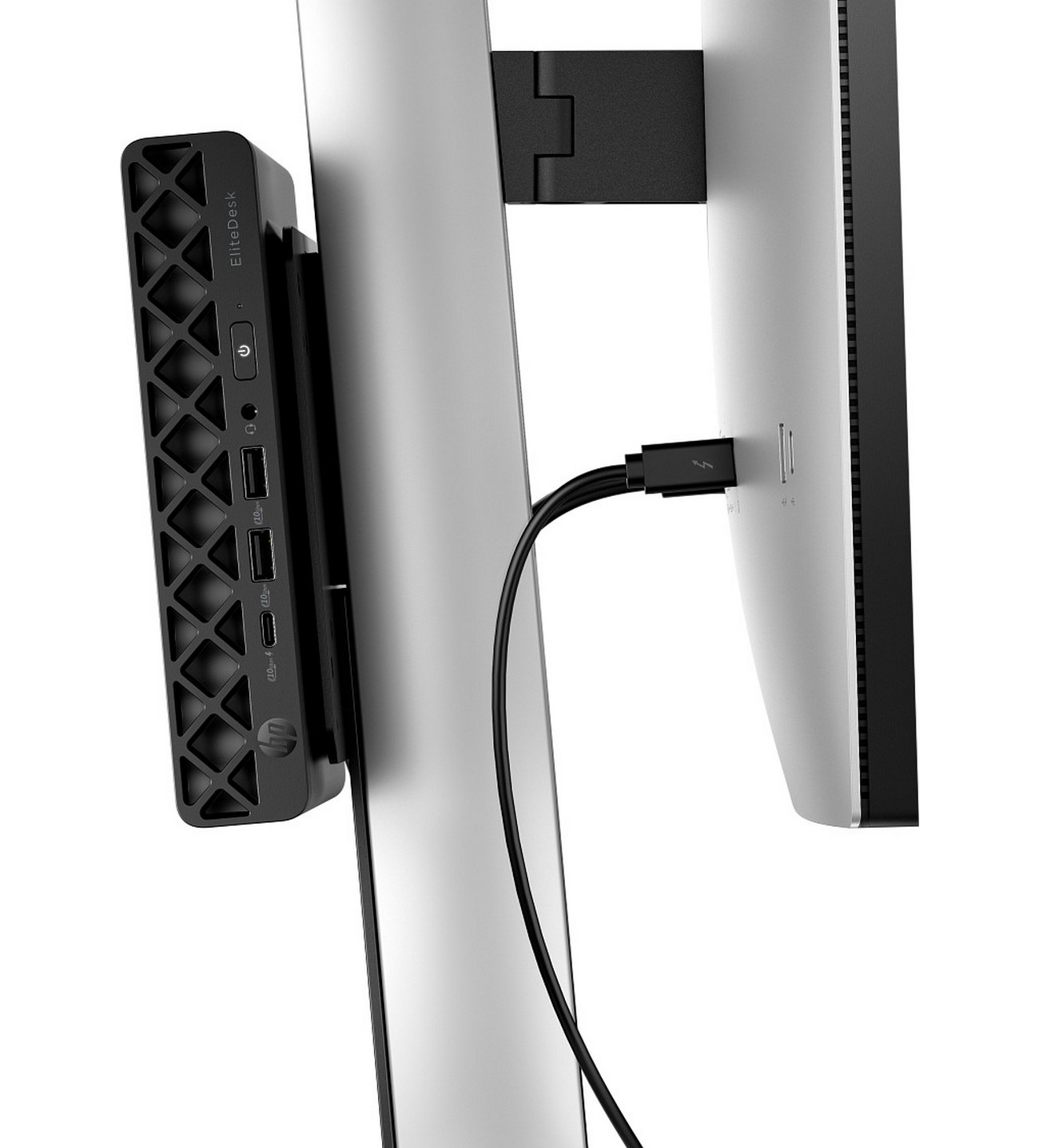 Un piccolo PC Mini nero HP è montato su un monitor. Un cavo li collega.
