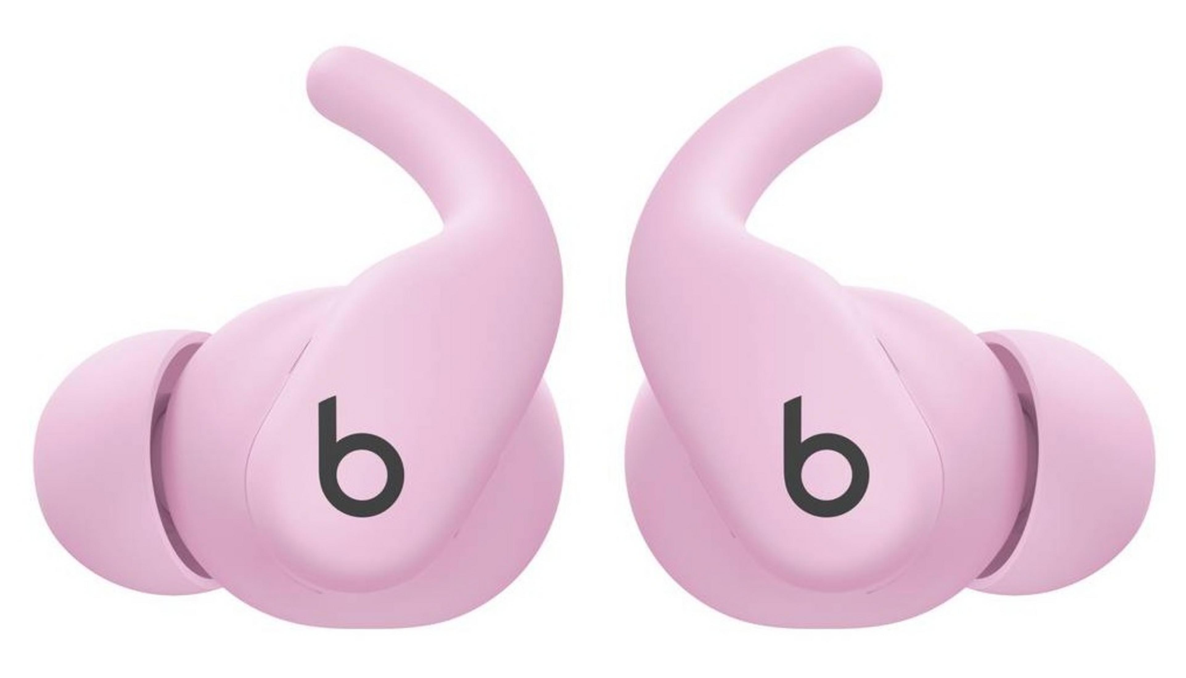 Due auricolari Beats rosa con logo 'b' nero uno accanto all'altro.
