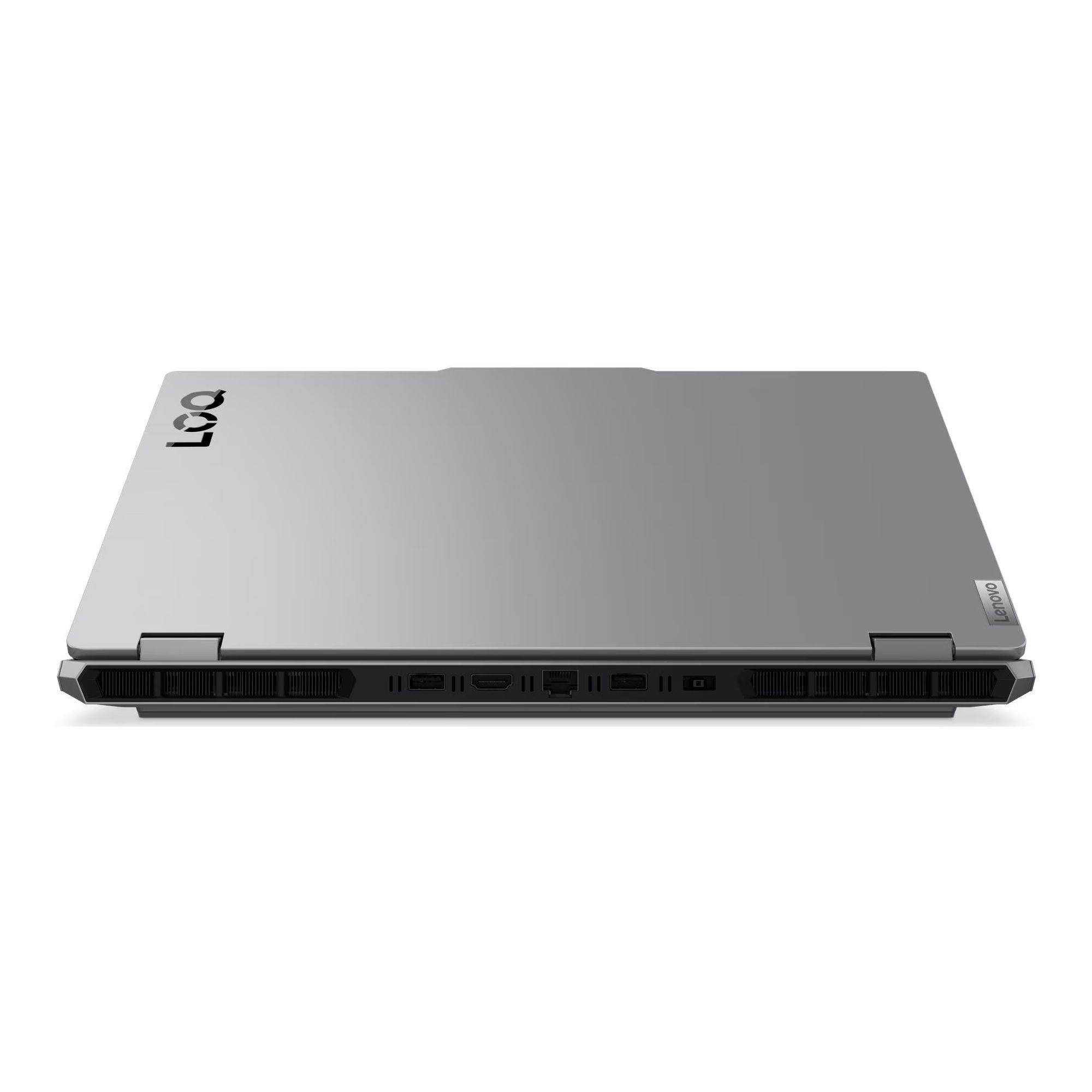 Zamknięty srebrny laptop z otworami wentylacyjnymi i portami z boku.