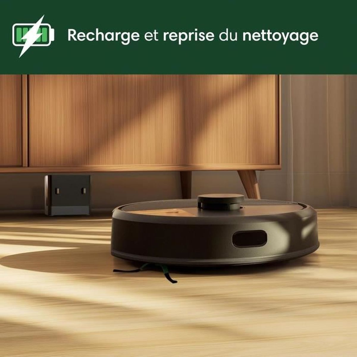 Robot sprzątający na drewnianej podłodze przed szafką.