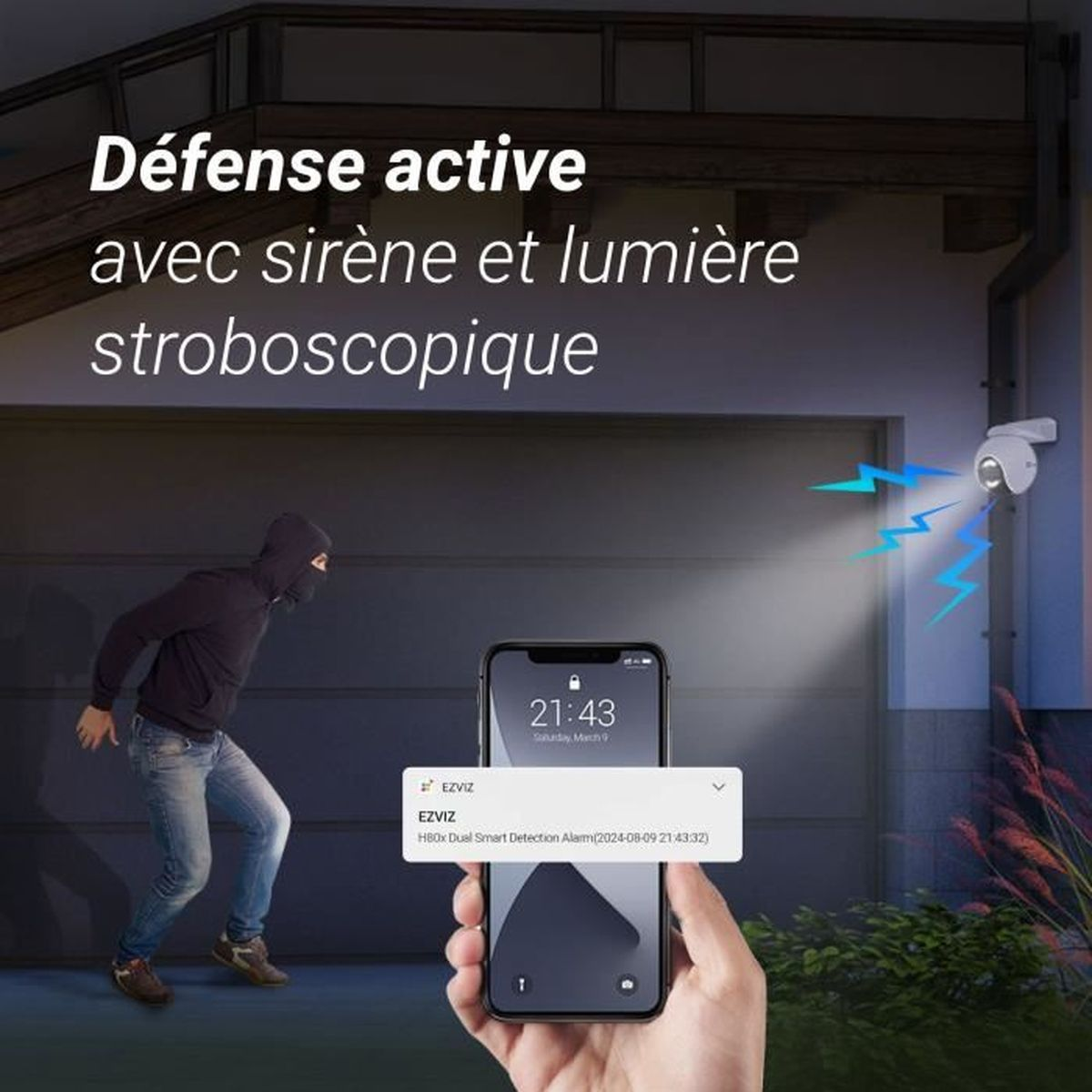 Włamywacz jest wykrywany przez kamerę z syreną i światłem. Telefon wyświetla powiadomienie.