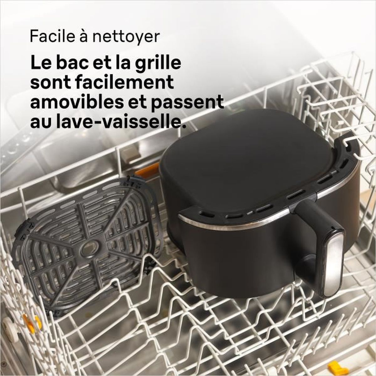 Czarna frytkownica beztłuszczowa i jej ruszt znajdują się w zmywarce.
