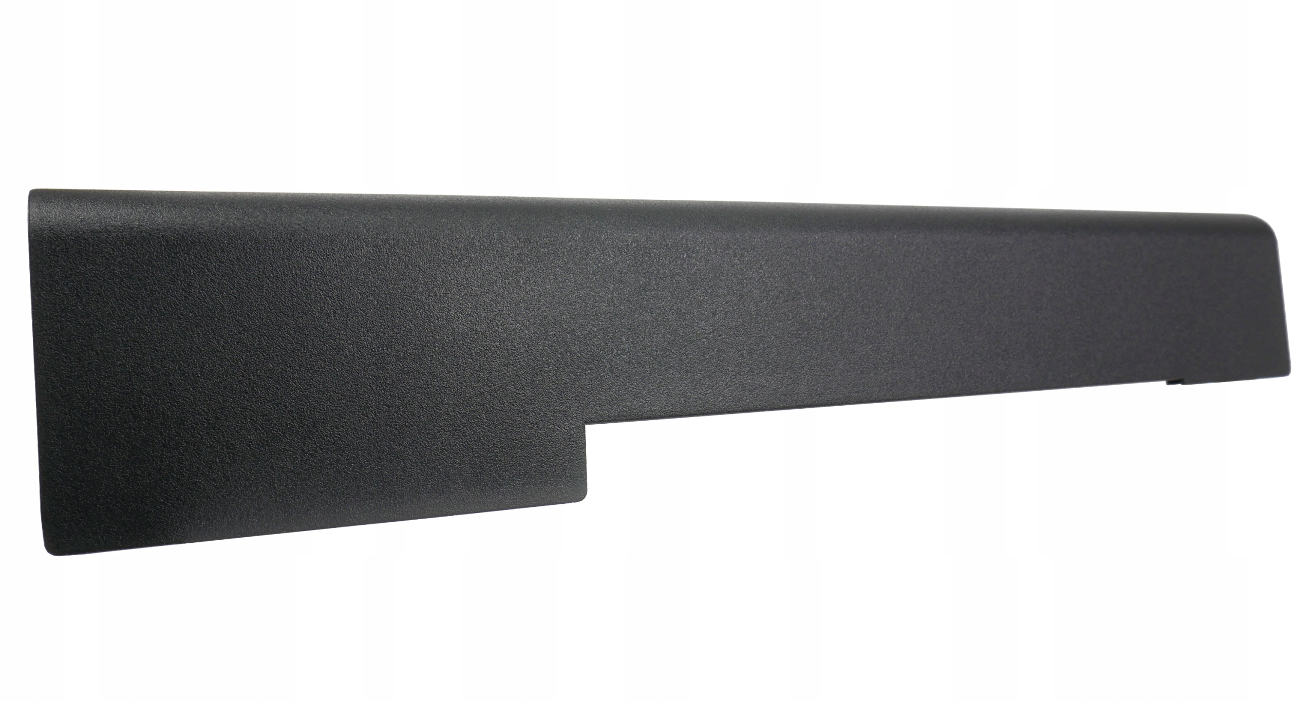 Czarna, teksturowana plastikowa część w kształcie litery L na białym tle.