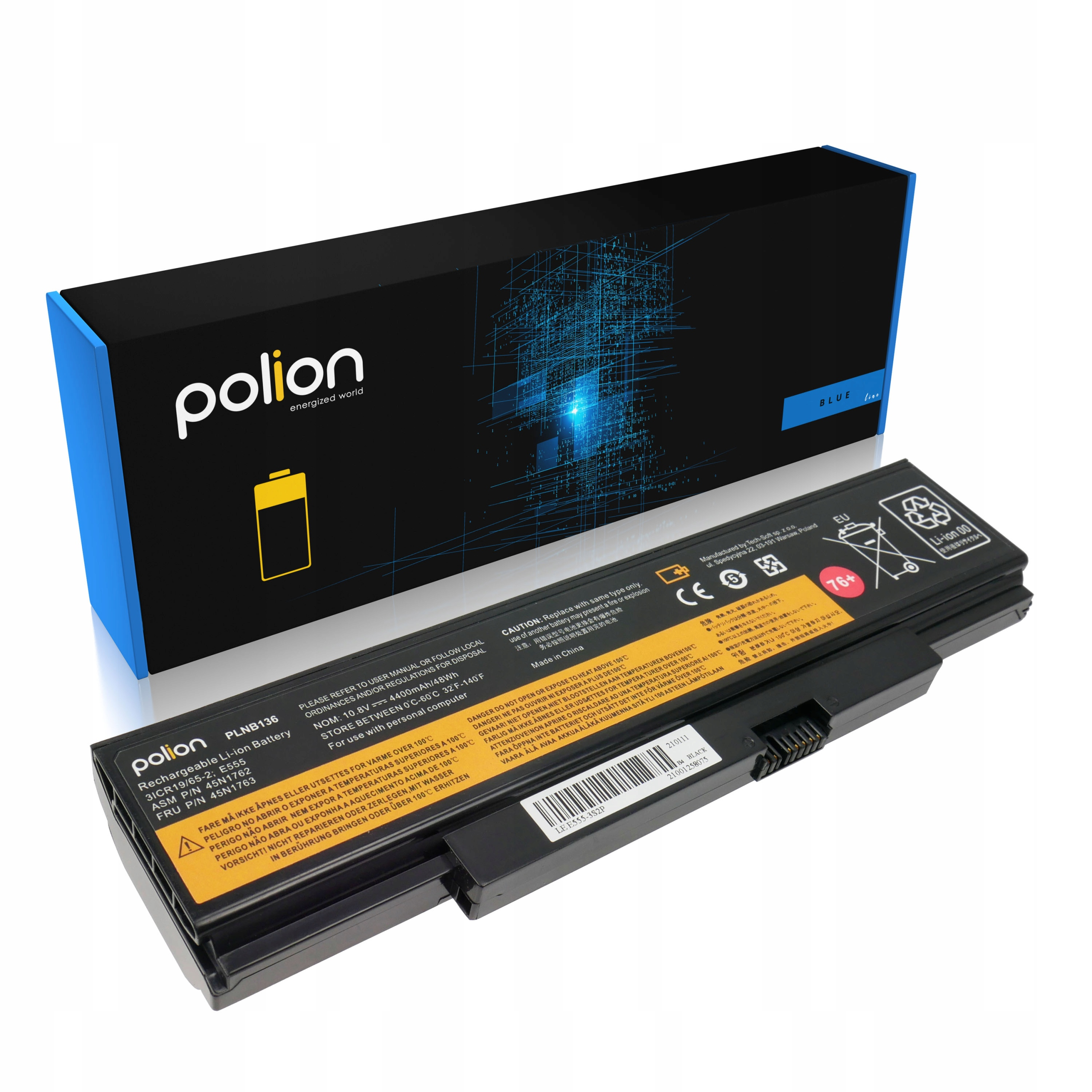 Czarny akumulator do laptopa z etykietami i ostrzeżeniami, obok czarnego pudełka.