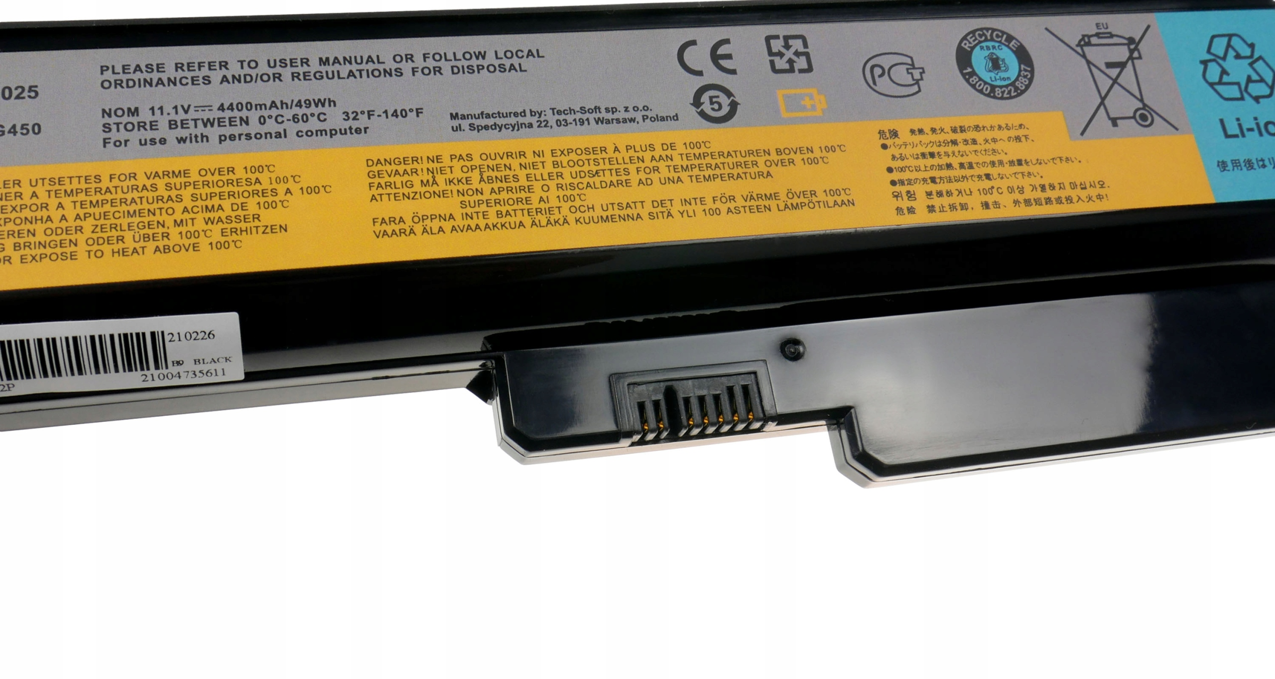 Czarna bateria do laptopa z etykietami ostrzegawczymi i specyfikacjami.