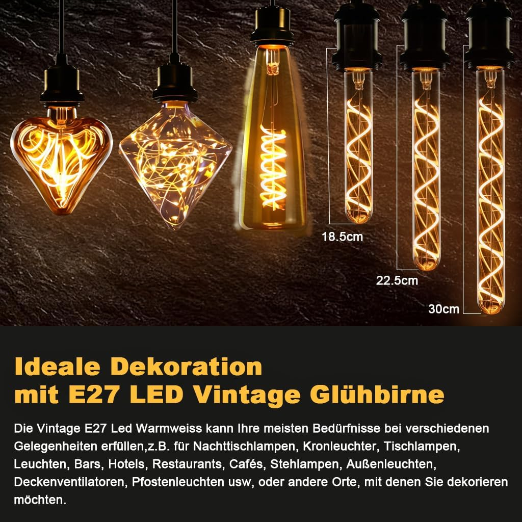 Quattro lampadine vintage a filamento, tre cilindriche e una a forma di cuore.