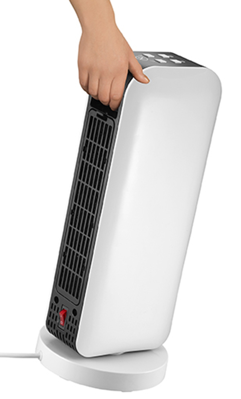 Ręka trzyma biały grzejnik z czarną kratką i czerwonym przełącznikiem u podstawy.