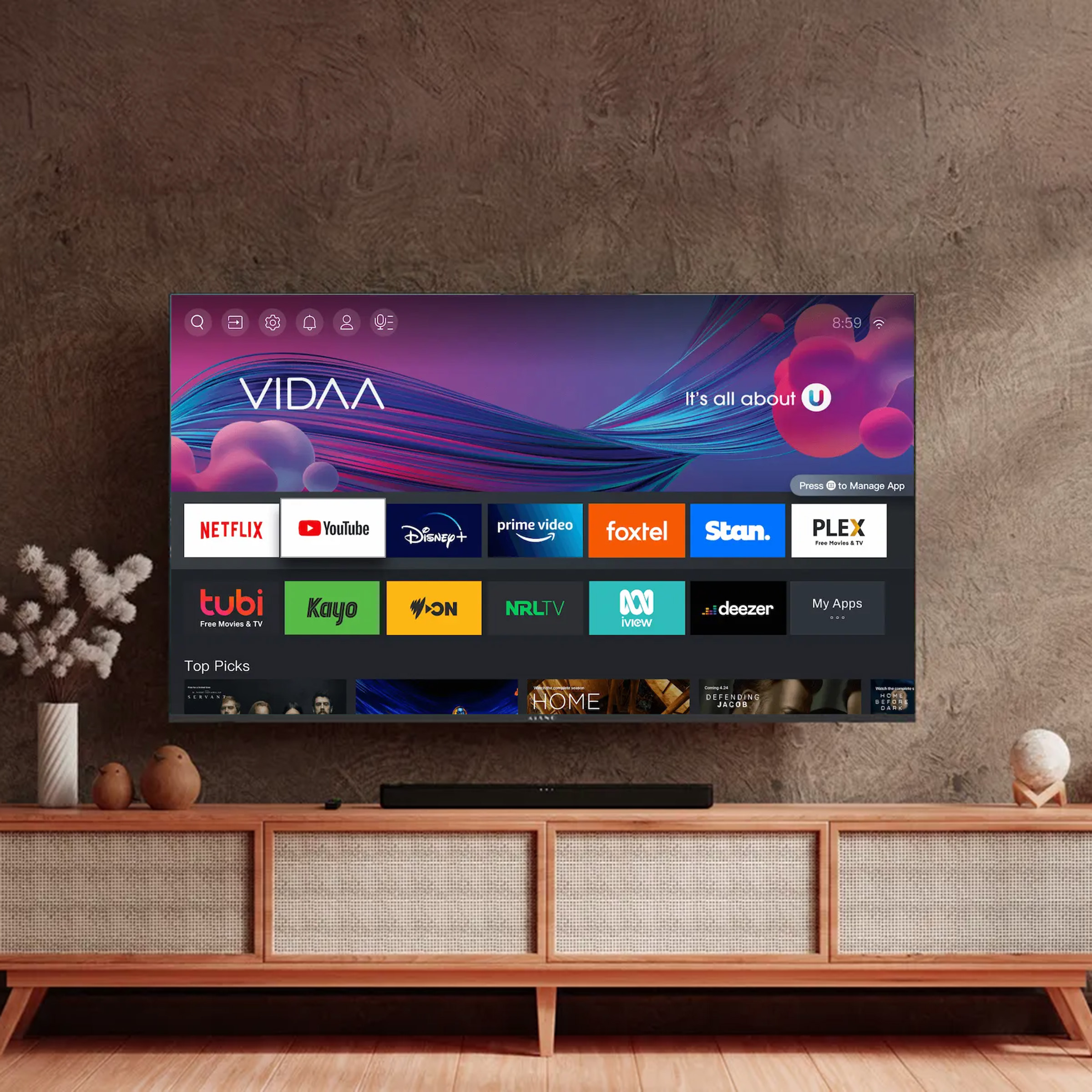 Nowoczesny telewizor wyświetla ekran główny VIDA z aplikacjami i soundbarem poniżej.