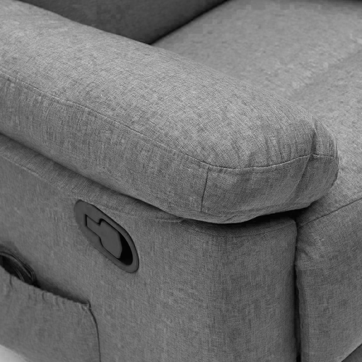 Szary fotel z podłokietnikiem i dźwignią zwalniającą.