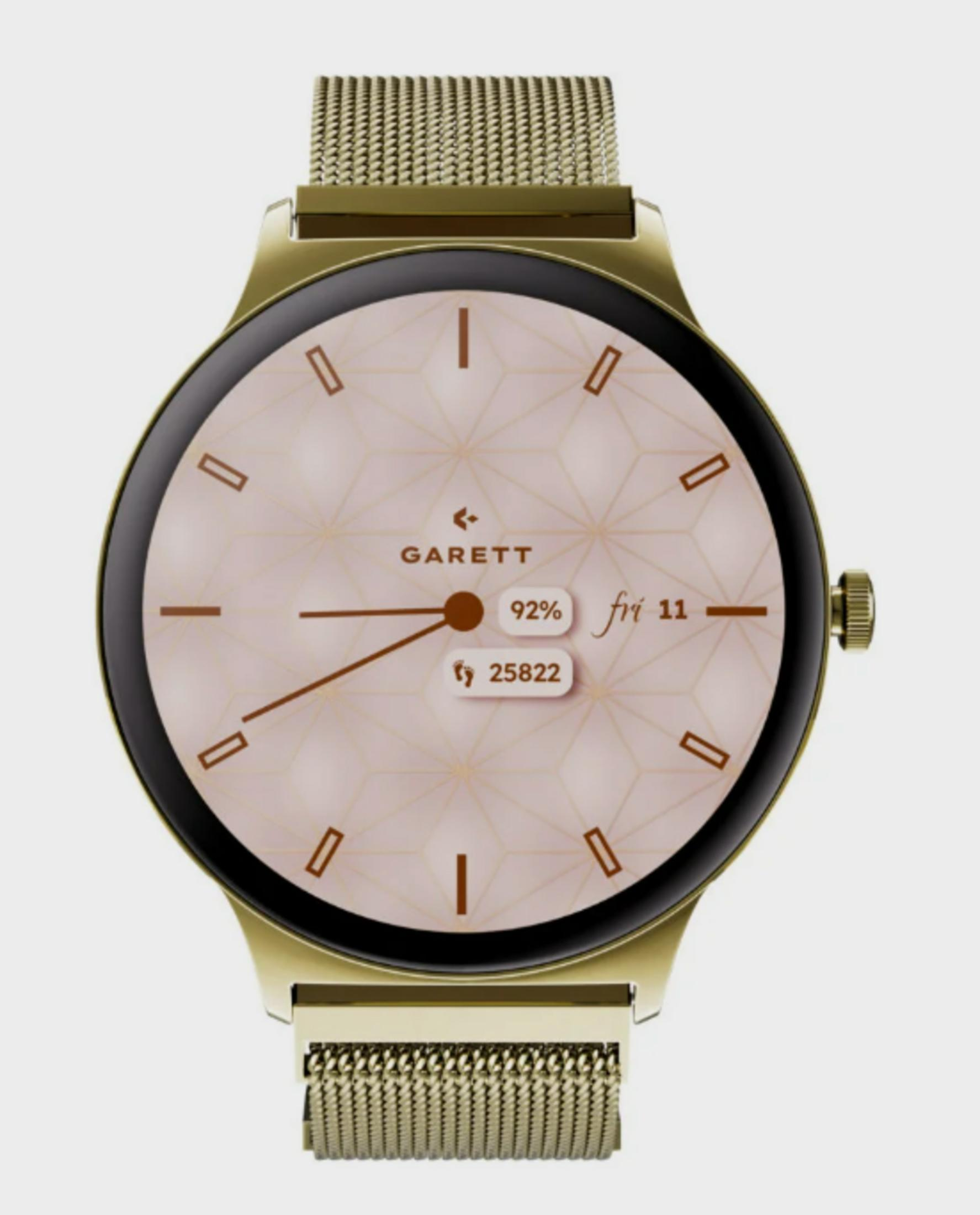 Uno smartwatch dorato con quadrante rosa pallido e motivo geometrico.