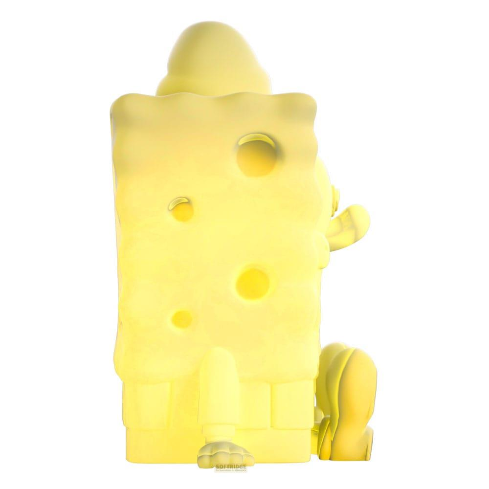 Eine gelbe Figur, die wie ein Käseblock aussieht, mit Löchern.