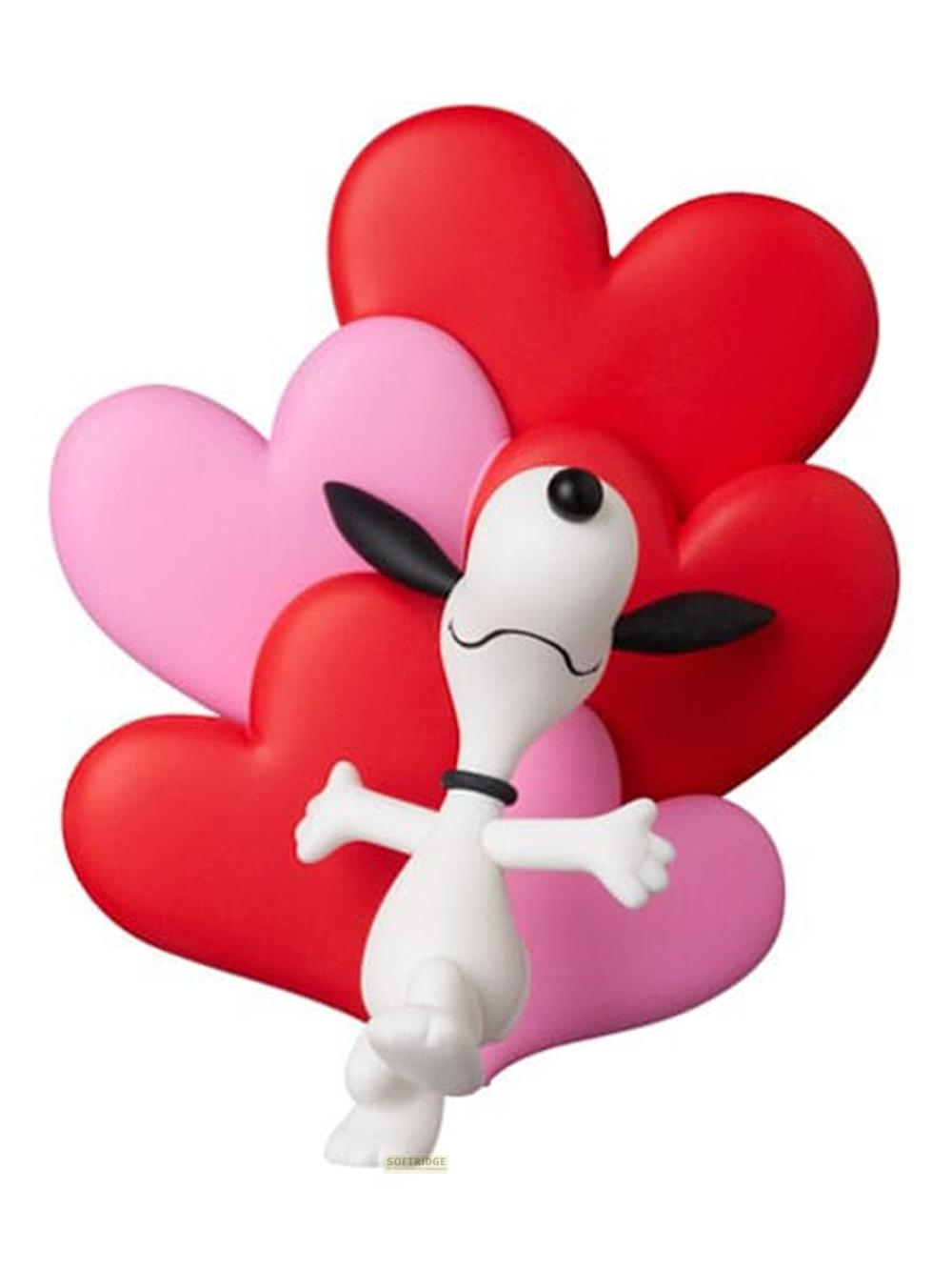 Snoopy steht vor roten und rosa Herzen, die wie eine Blume angeordnet sind.