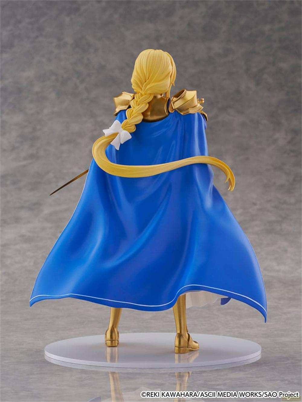 Figur mit blondem Zopf, goldener Rüstung und blauem Umhang.