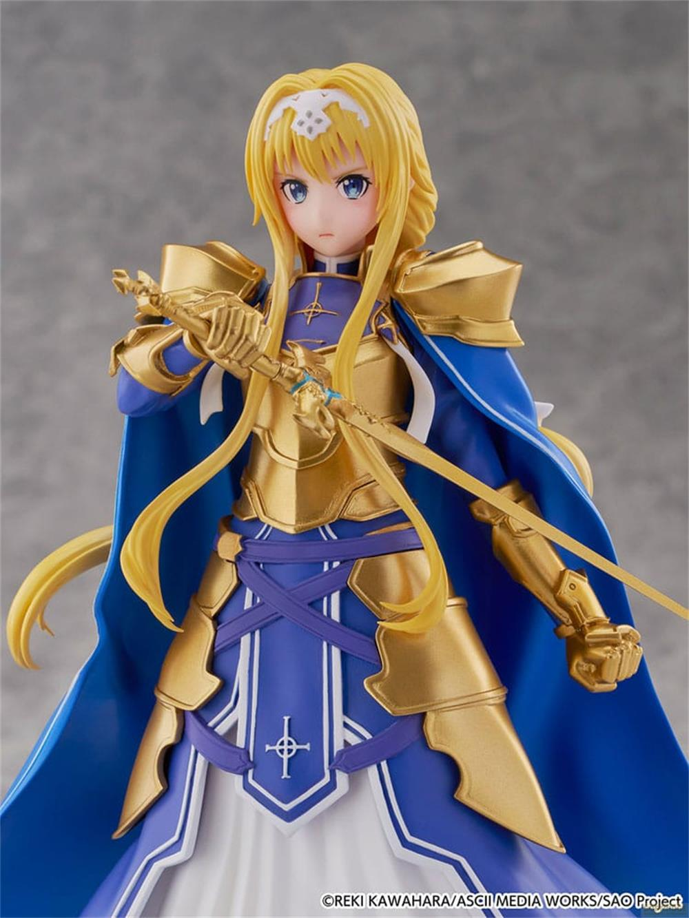 Eine Figur mit blonden Haaren und blauer Rüstung hält ein Schwert.