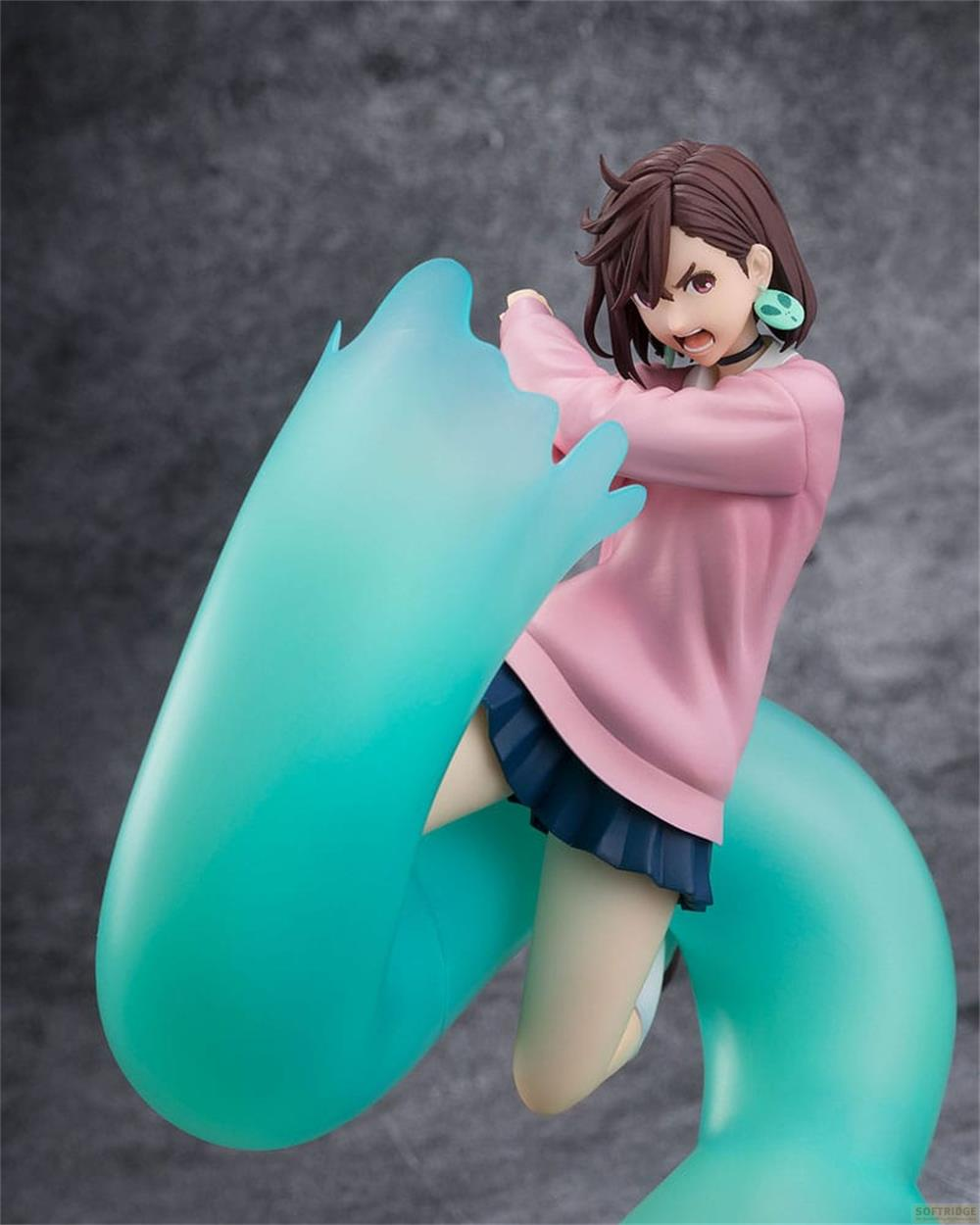 Eine Figur mit pinkem Pullover und blauem Rock, umgeben von türkisfarbener Energie.