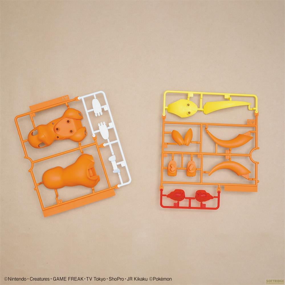 Zwei Spritzgussrahmen mit orangefarbenen, gelben und roten Kunststoffteilen für Modellbausätze.