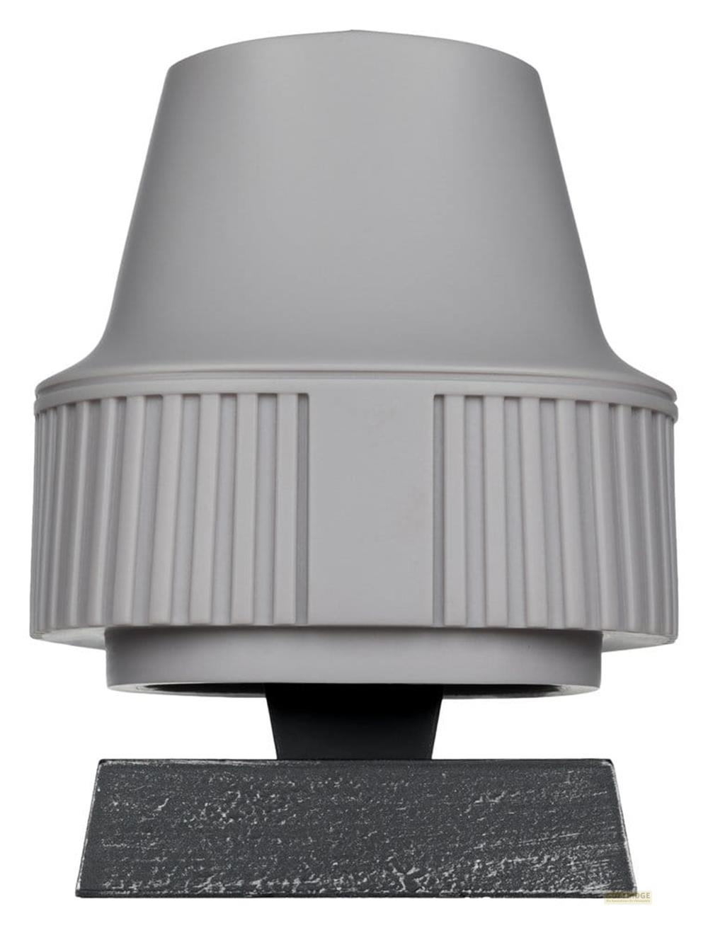 Oggetto cilindrico grigio con scanalature verticali su una base scura.