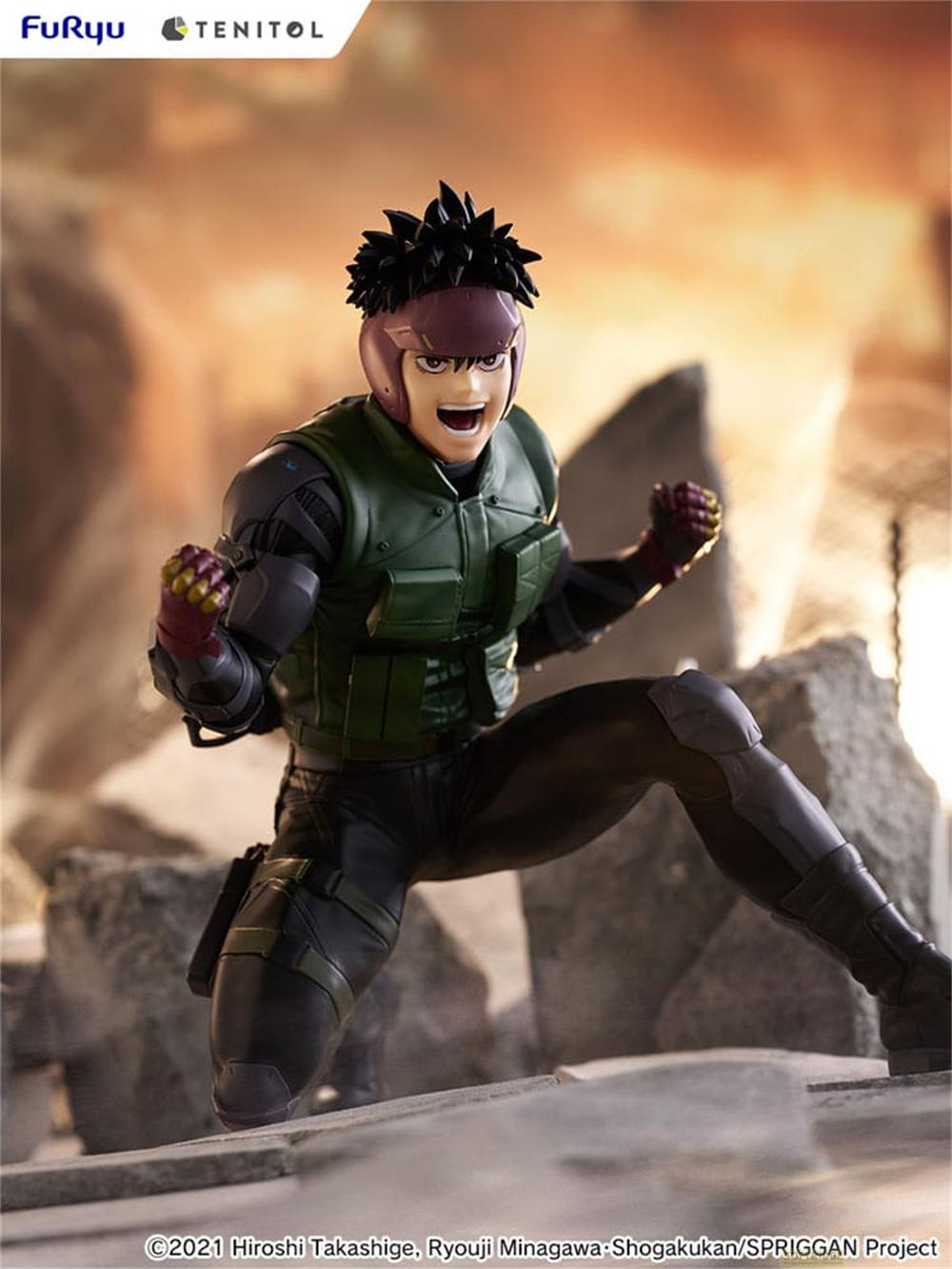 Eine Actionfigur eines Mannes mit Irokesenschnitt, der eine grüne Weste trägt, kniet.