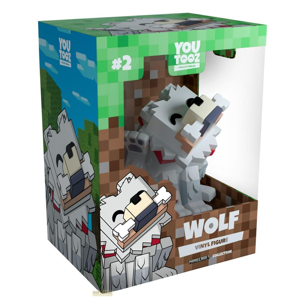 Eine Minecraft Wolf Vinylfigur in einer grünen und braunen Verpackung.