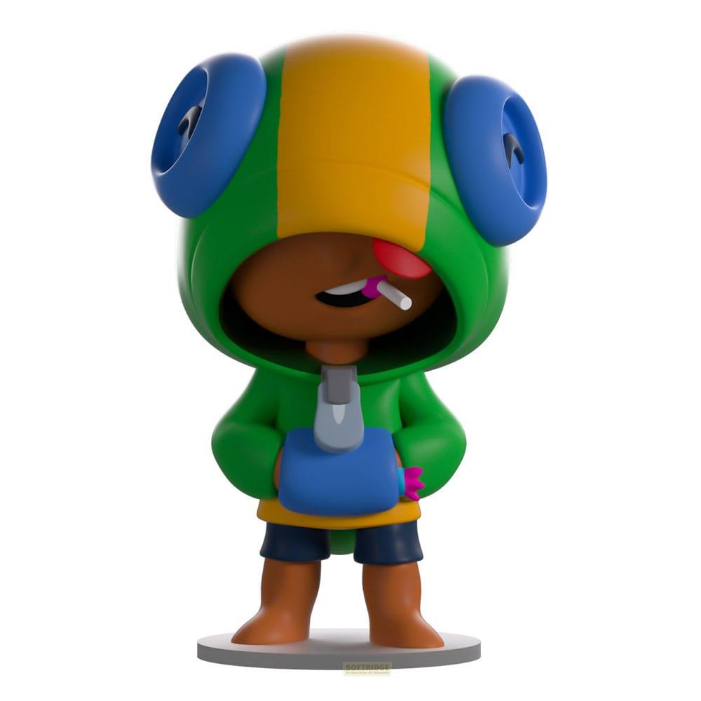Eine Figur in einem grünen Hoodie mit gelben Streifen und blauen Ohren. Sie hält etwas in der Hand.