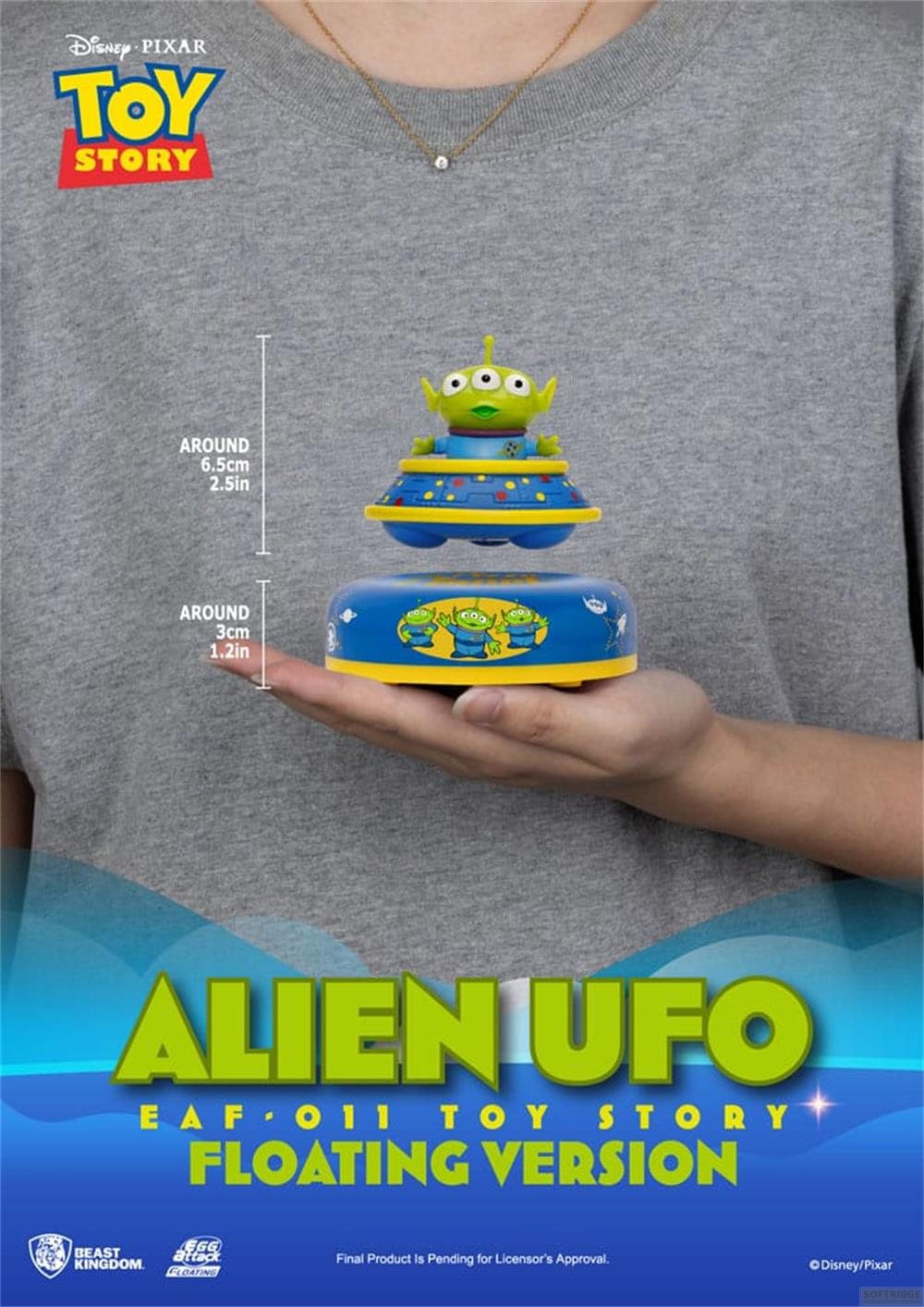 Ein Alien aus Toy Story schwebt über einer UFO-Basis, die von einer Hand gehalten wird.