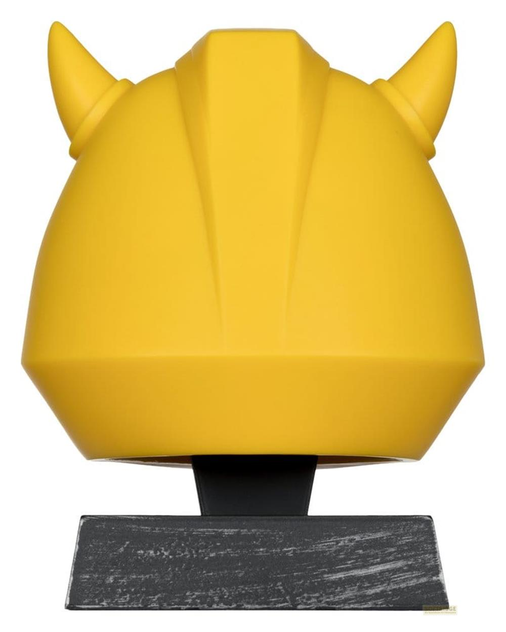 Un casco giallo con corna su una base grigia.