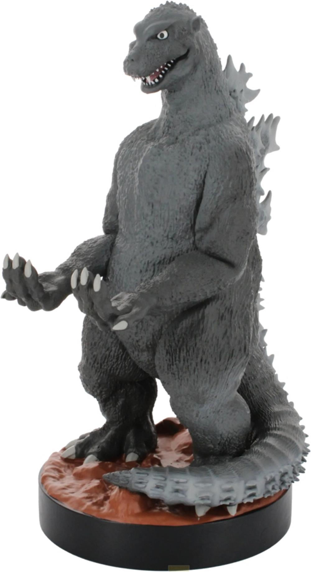 Graue Godzilla-Figur auf braunem Podest mit spitzen Zähnen und Krallen.