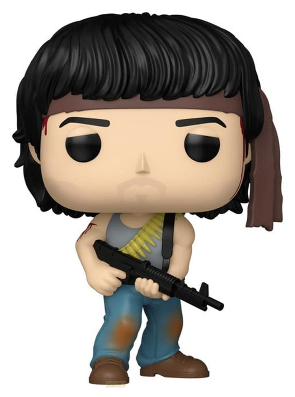 Figur mit Stirnband, Munitionsgurt und Gewehr. Blaue Hose, graues Oberteil.