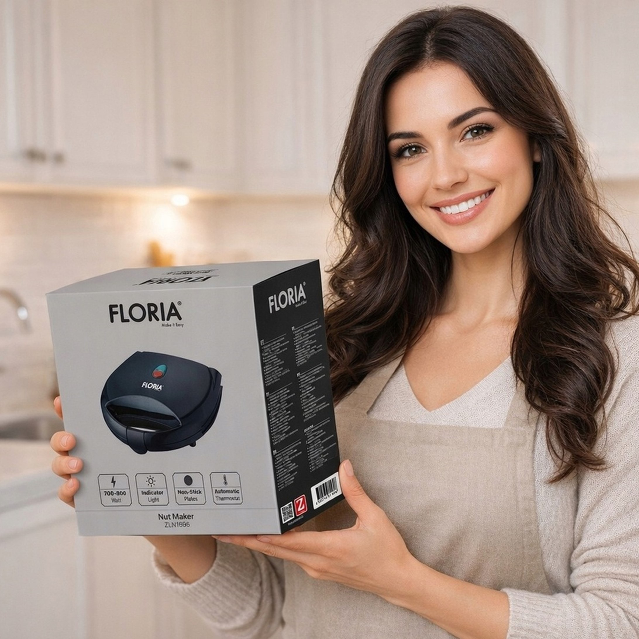 Kobieta trzyma pudełko Floria Nut Maker z obrazem urządzenia i specyfikacją.