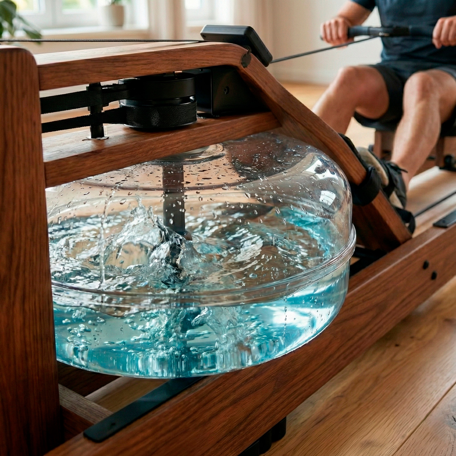 Man on a wooden rowing machine, water splashing in the tank.
