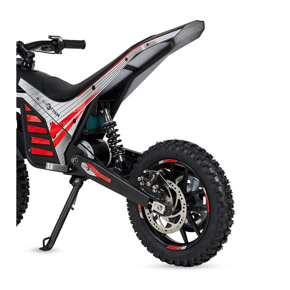 Una dirt bike eléctrica negra con detalles rojos y neumático de tacos.