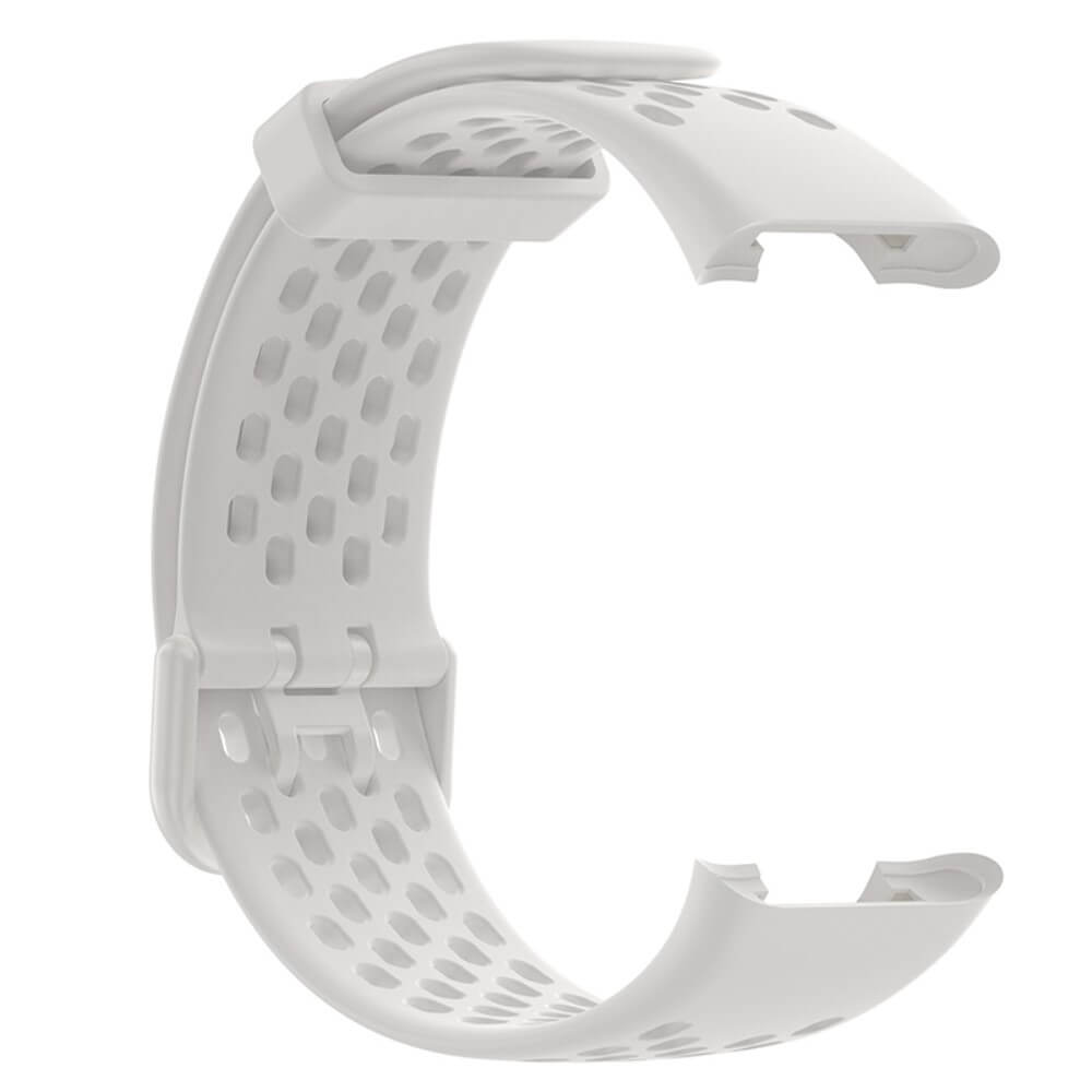 Un bracelet de montre blanc et perforé avec un mécanisme de fermoir.