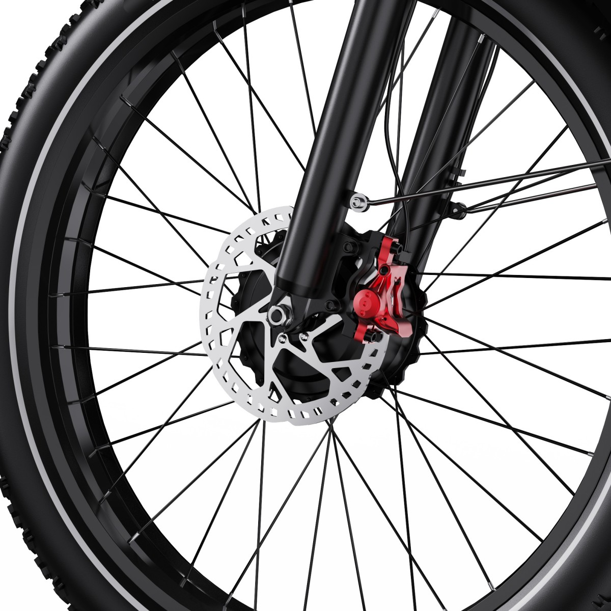 Zbliżenie koła roweru z hamulcem tarczowym i czerwonym zaciskiem.