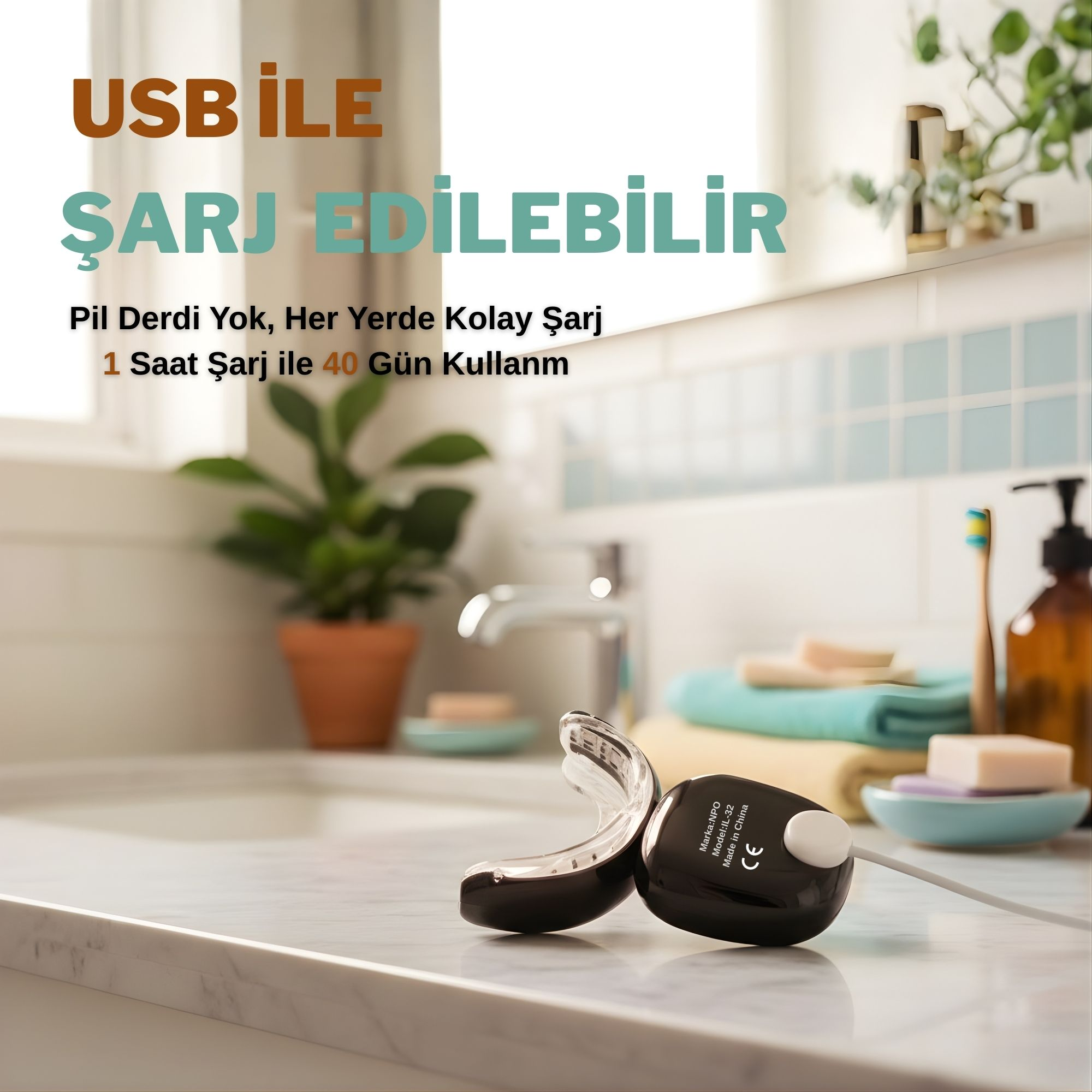 Siyah USB şarjlı ağızlık mermer tezgahta duruyor. Arkada havlu ve sabun var.