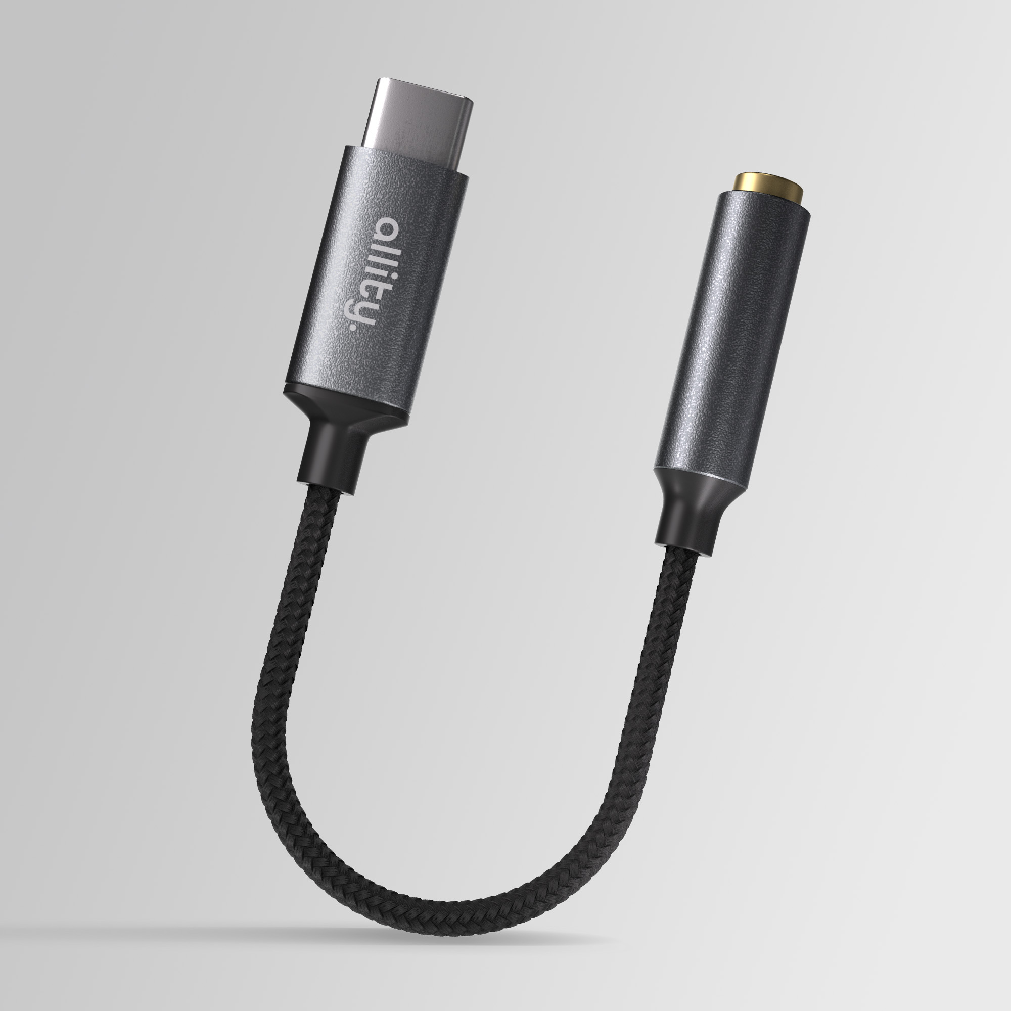 Szary adapter USB-C na 3,5 mm z plecionym kablem.