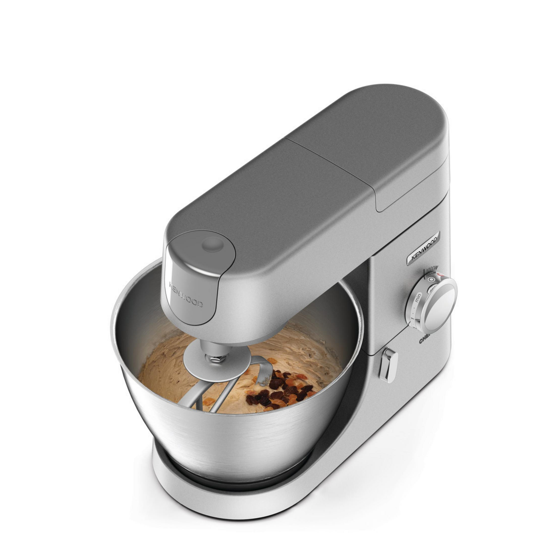 Srebrny mikser kuchenny Kenwood z misą i składnikami ciasta.