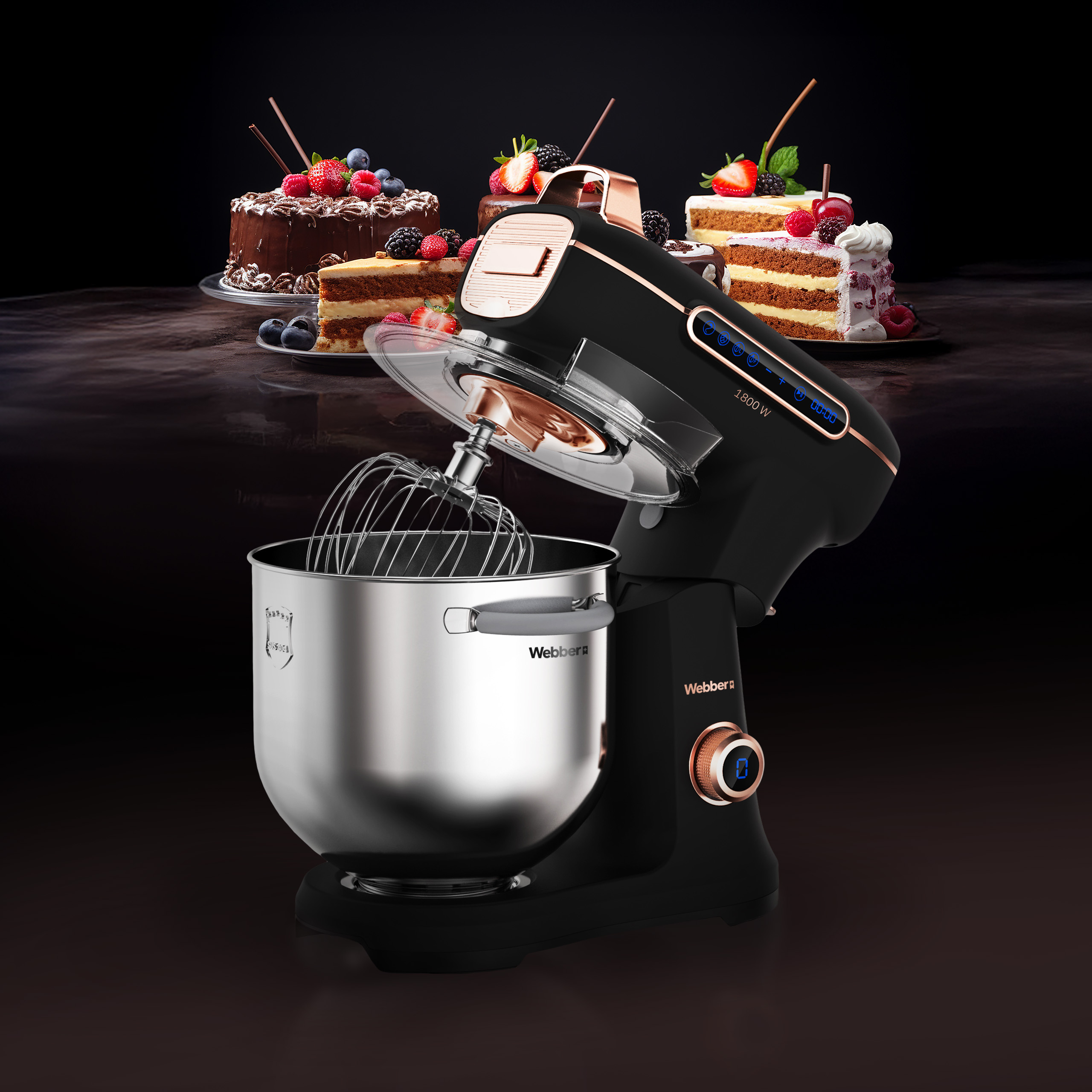 Czarny mikser kuchenny z misą ze stali nierdzewnej i ciastami w tle.