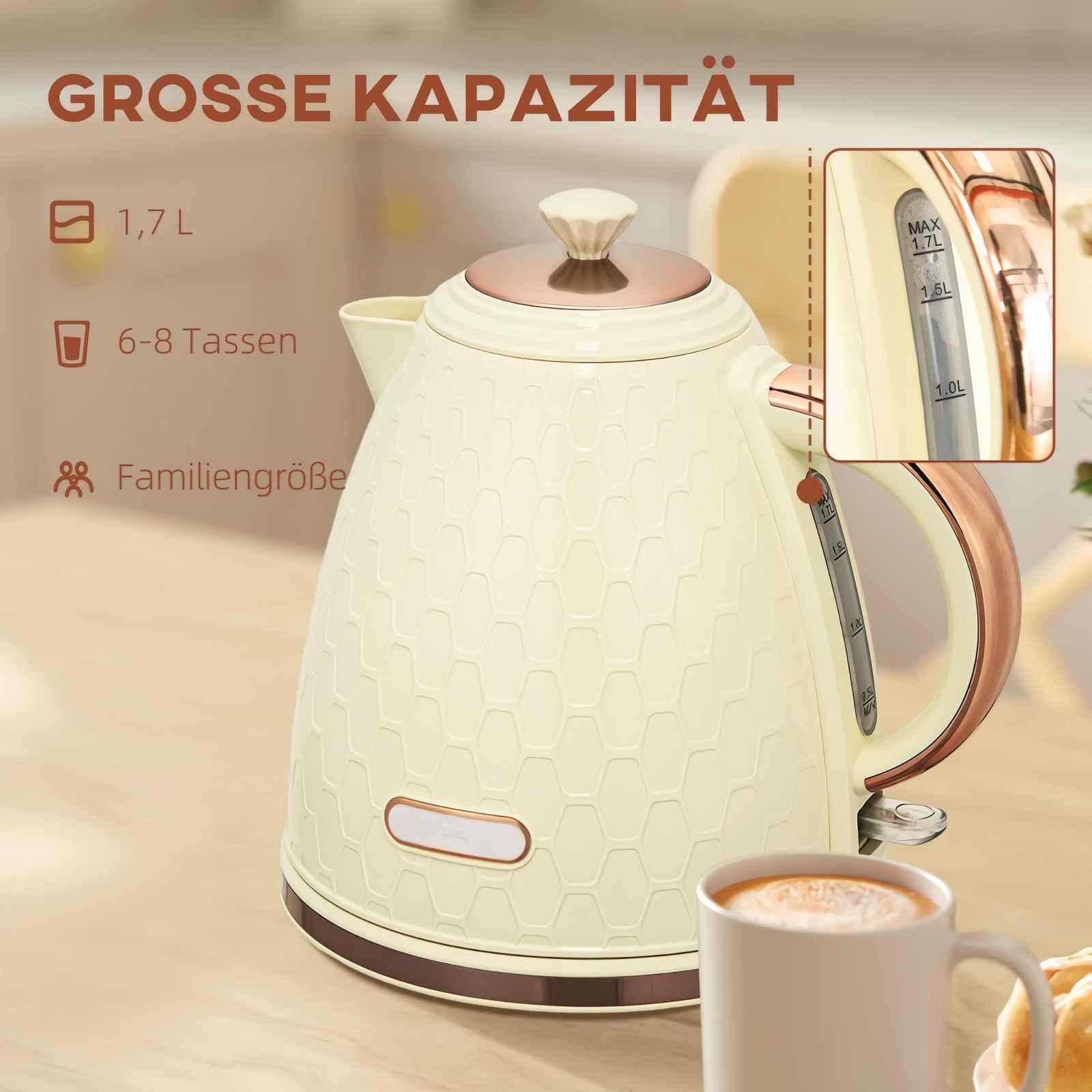 Eine cremefarbene Teekanne mit roséfarbenen Akzenten steht auf einem Tisch.