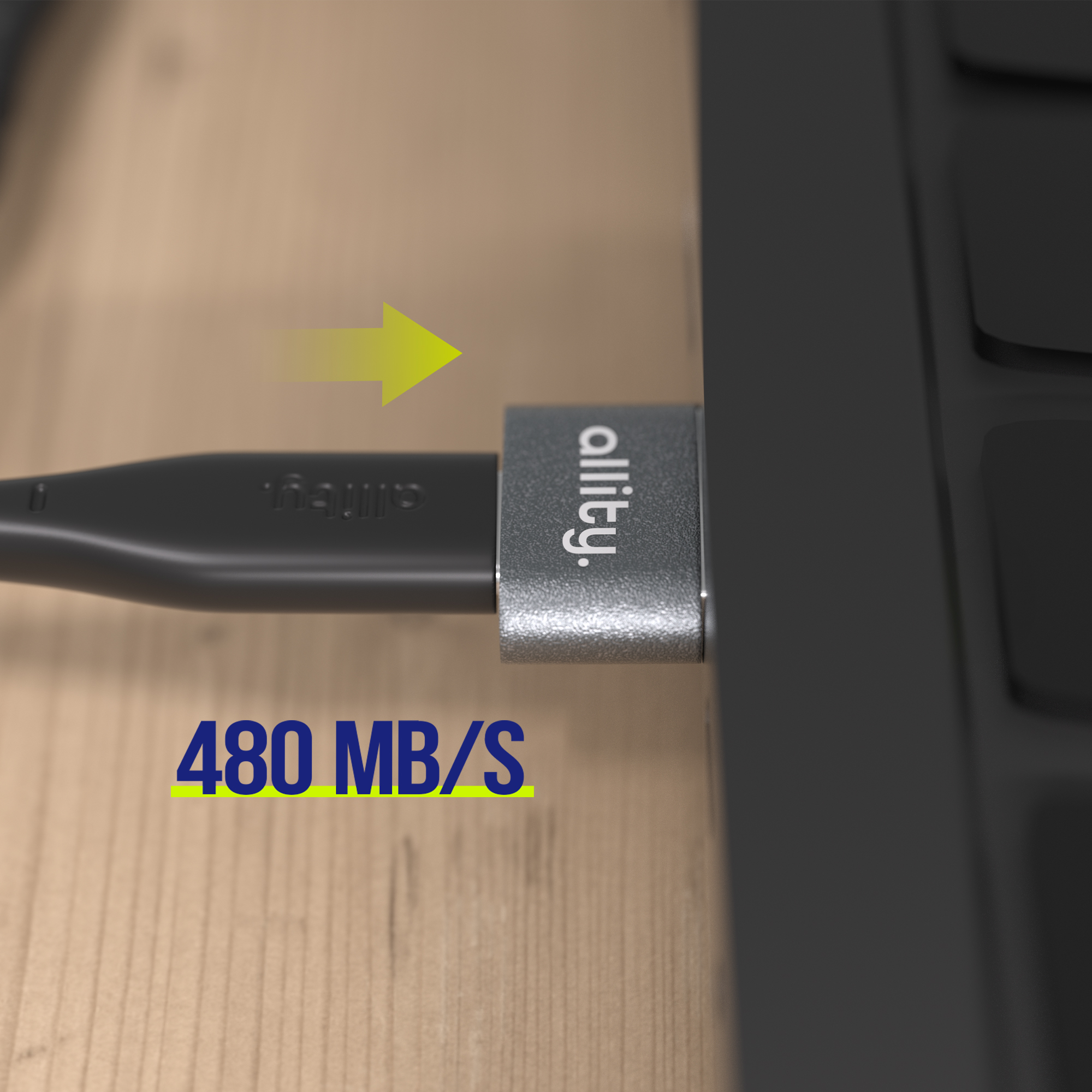 Szary wtyk USB z logo "allity." jest wkładany do laptopa.