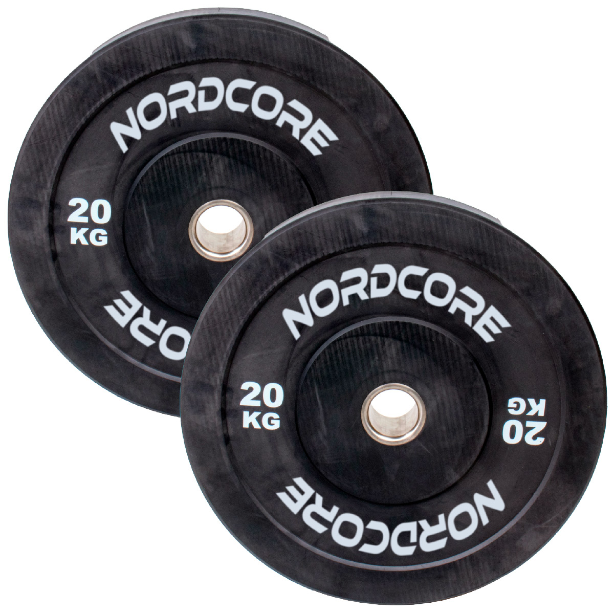 Dwa czarne talerze o wadze 20 kg z logo "NORDCORE" stoją obok siebie.