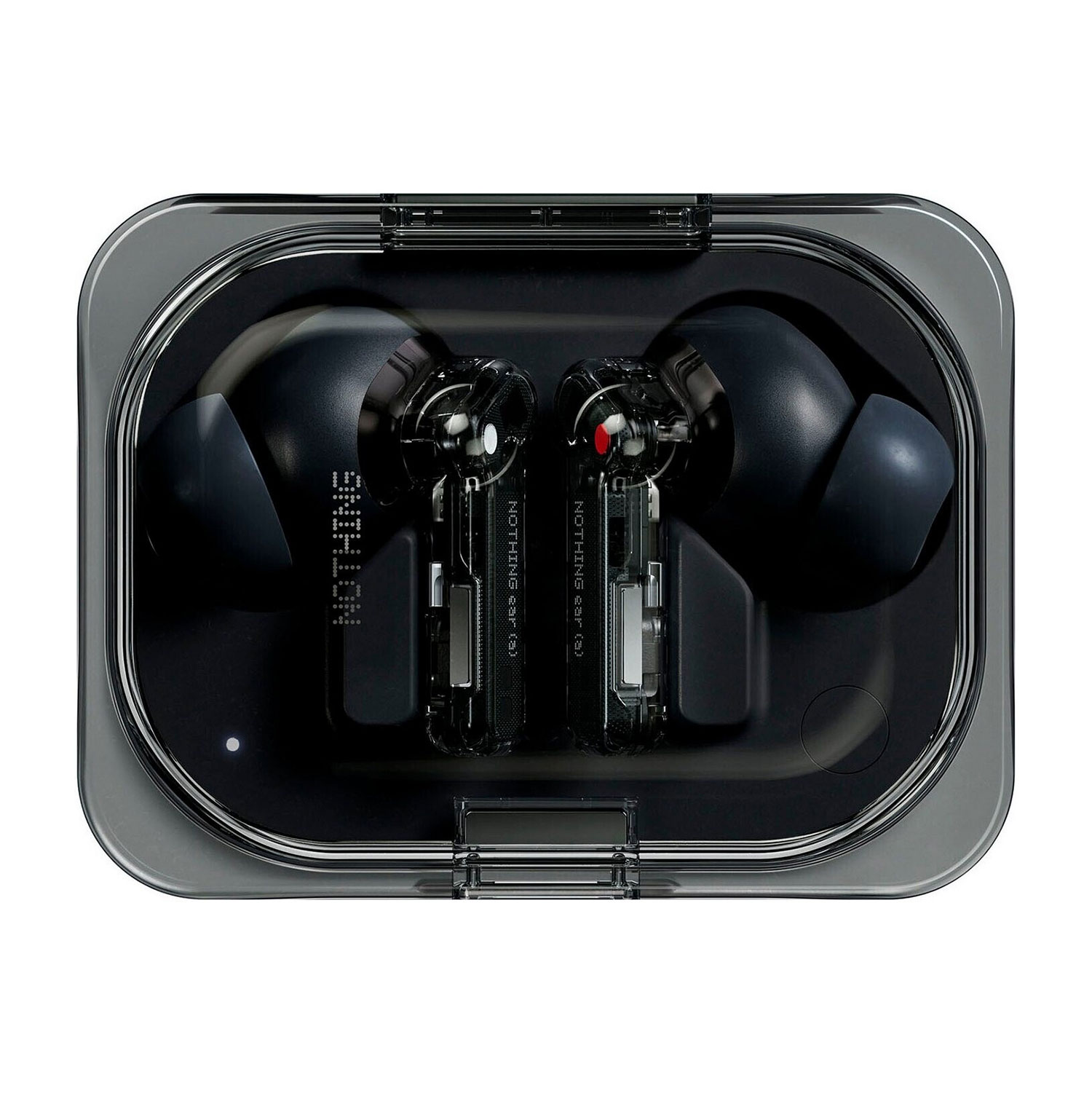 Czarne słuchawki w przezroczystej ładowarce, zbliżenie.