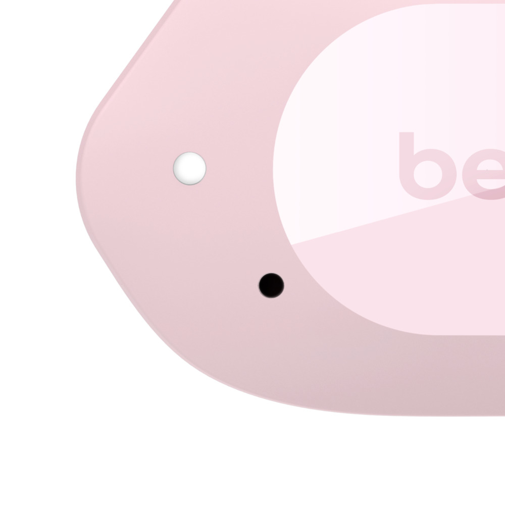 Un objeto rosa con un punto blanco y uno negro. Se ve el texto 'be'.