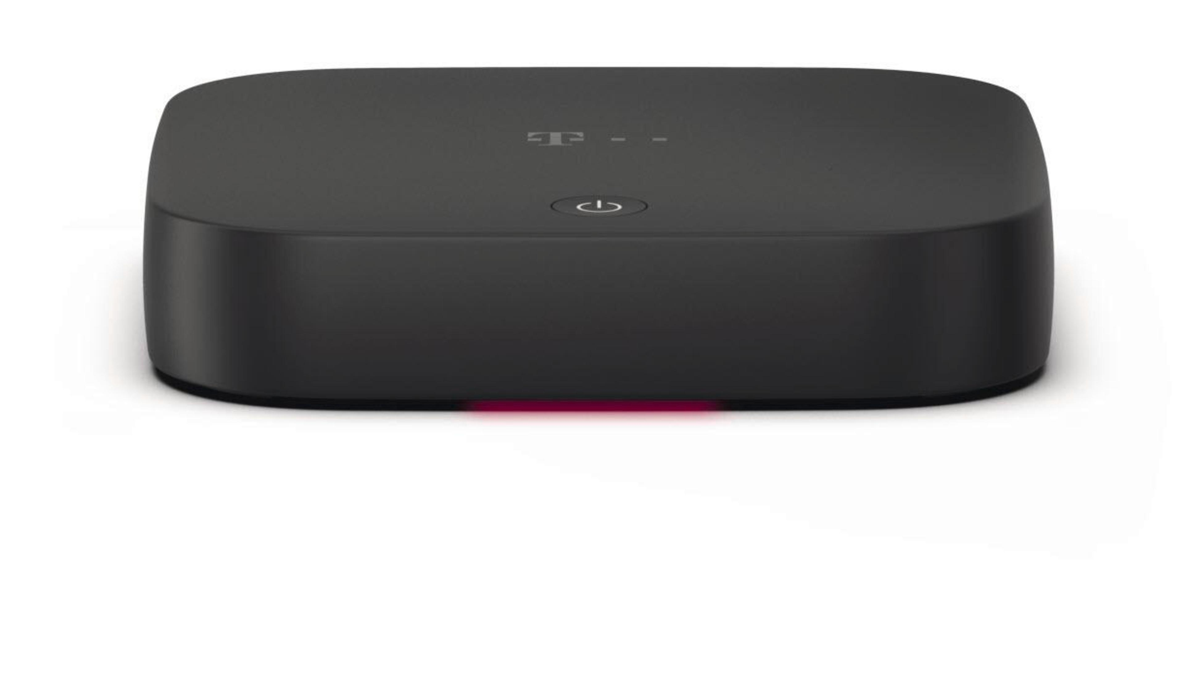 Ein schwarzes, rechteckiges T-Mobile-Gerät mit einem Power-Symbol und roter LED.