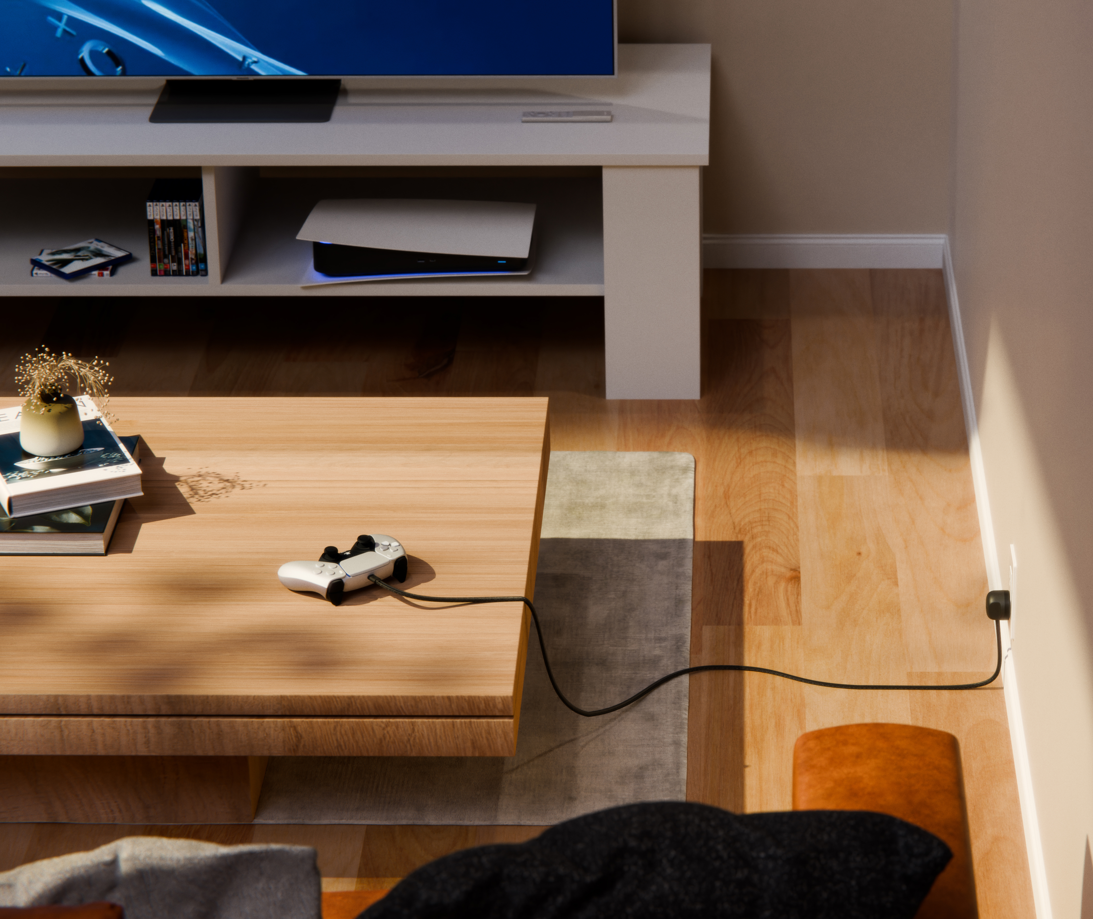Ein weißer Controller liegt auf einem Holztisch, verbunden mit einem Kabel.