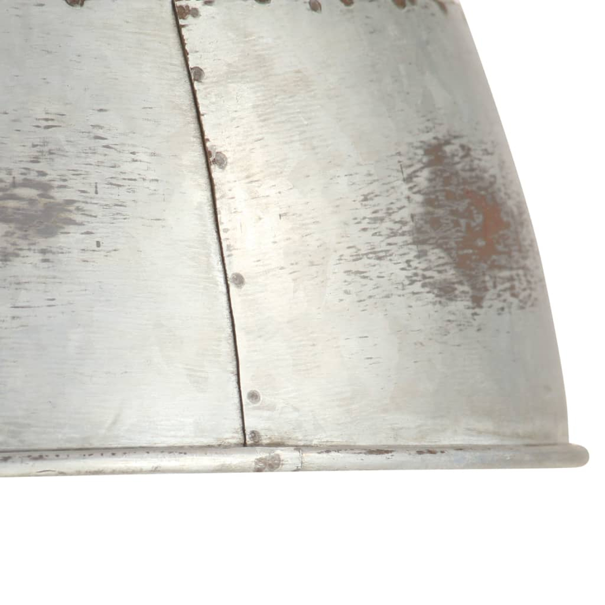 Grauer Metallschirm mit Nieten und Rostflecken.