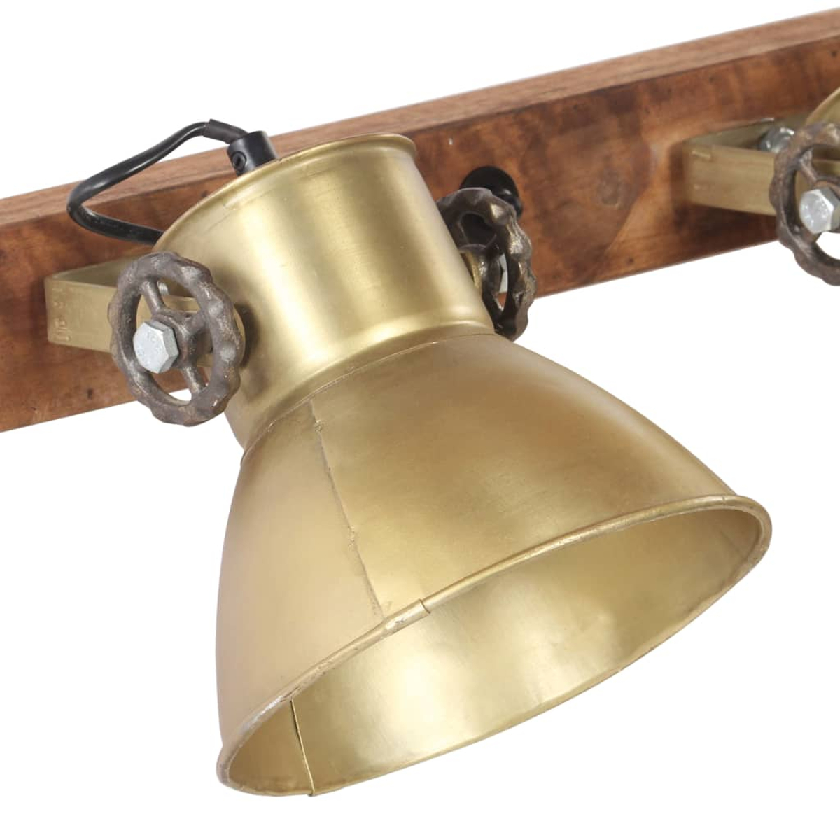 Ein Messing-Spotlicht mit zwei Rädern, montiert auf einem Holzbrett.