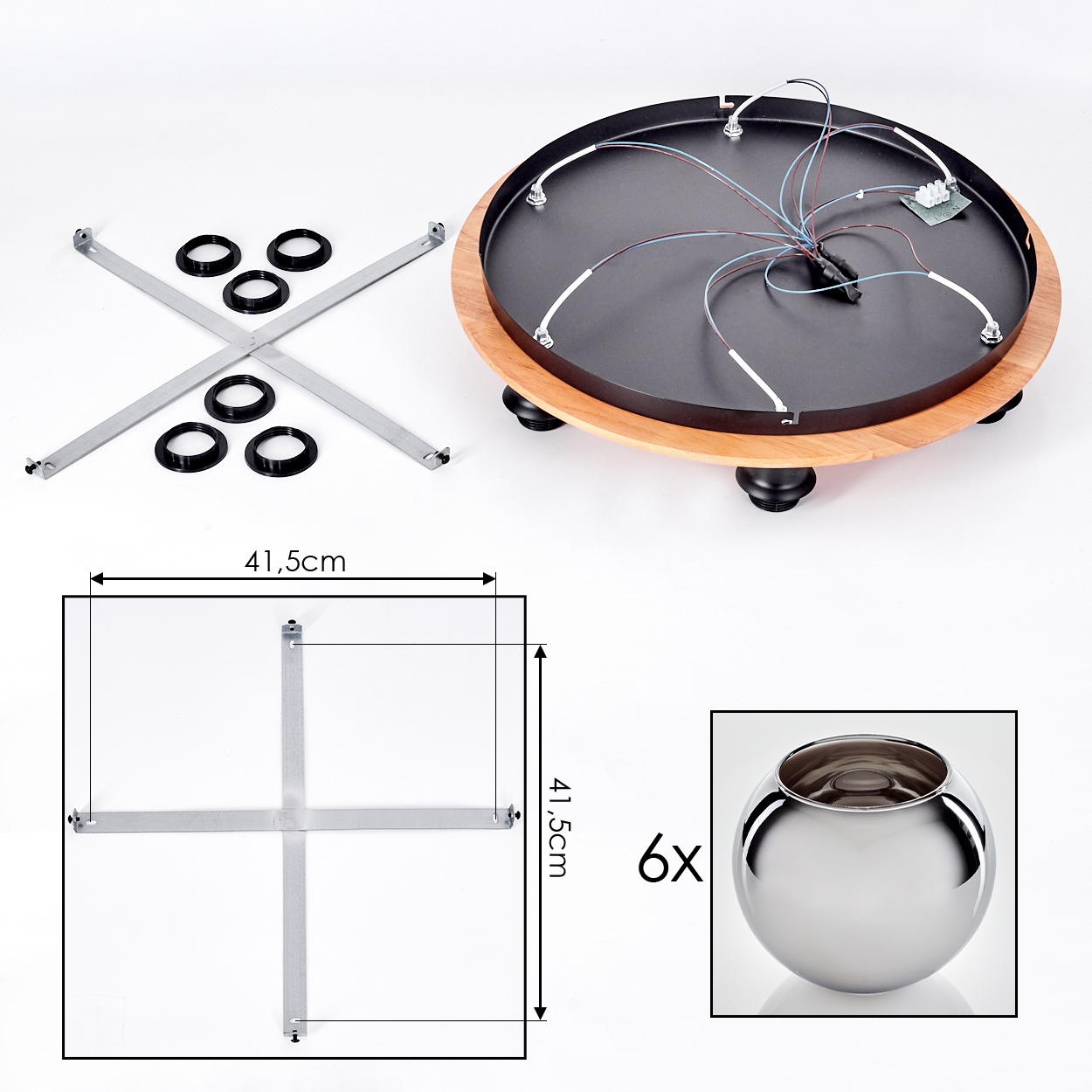 Teile eines runden Geräts mit Holzakzent, Metallkreuz und Glaskugel.