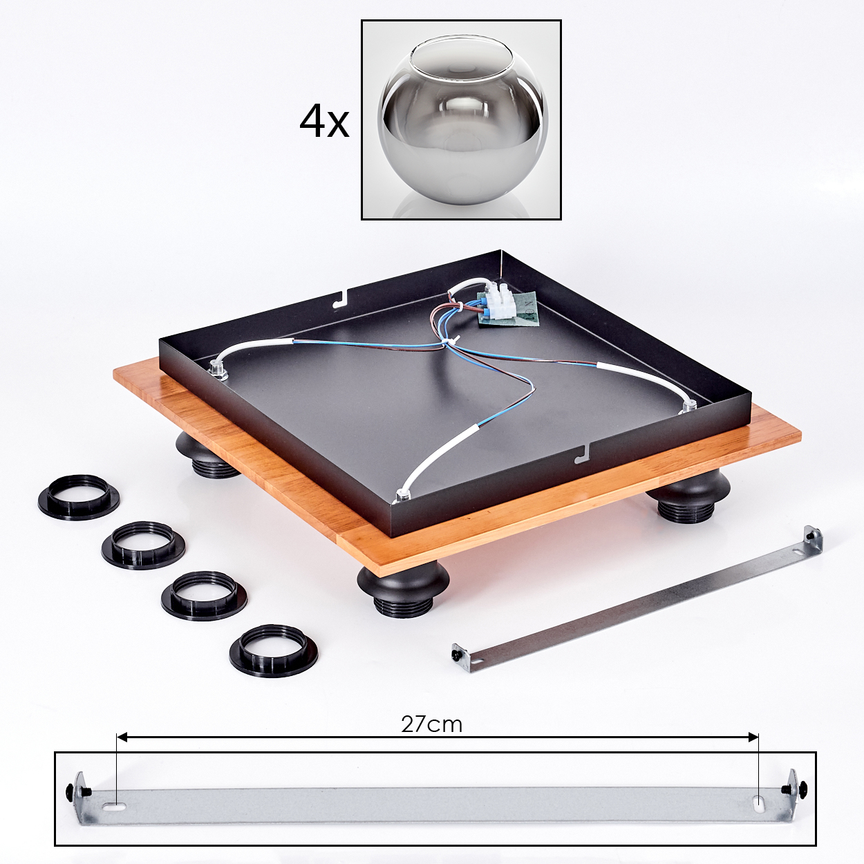 Teile eines Plattenspielers: 4 Kugeln, Holzbasis, schwarzes Gehäuse, Kabel und Metallstreben.